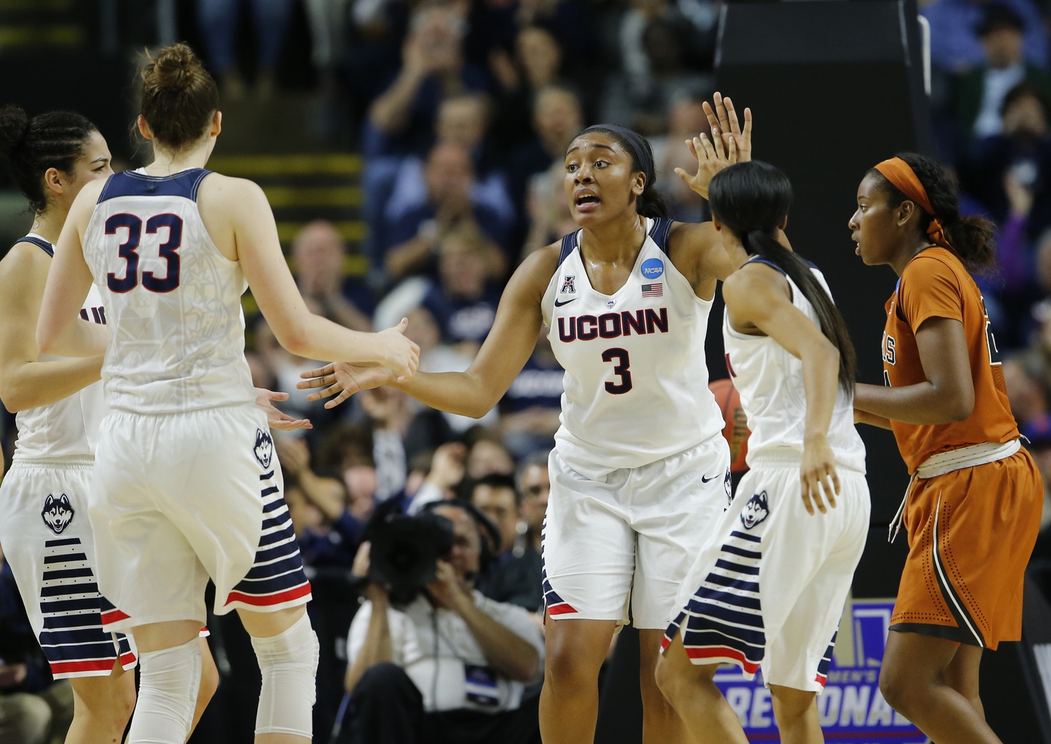 Connecticut Huskies forward Morgan Tuck (3) reacts after a play against the Texas Longhorns during the second half in the finals of the Bridgeport regional of the women's NCAA Tournament at Webster Bank Arena. UConn defeated Texas 86-65.