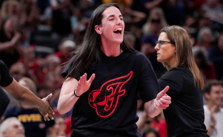 Indiana Fever guard Caitlin Clark (22) yells in excitement Wednesday, July 30, 2025, during the game at Gainbridge Fieldhouse in Indianapolis. The Indiana Fever defeated the Phoenix Mercury, 107-101.