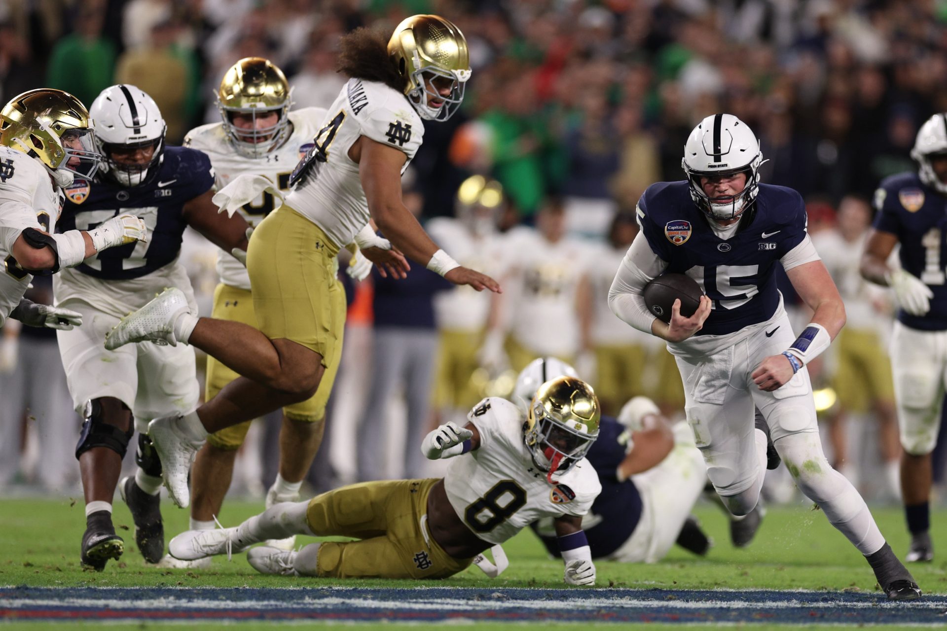 Penn State Nittany Lions quarterback Drew Allar (15) runs the ball in the second half against the Notre Dame Fighting Irish in the Orange Bowl at Hard Rock Stadium.