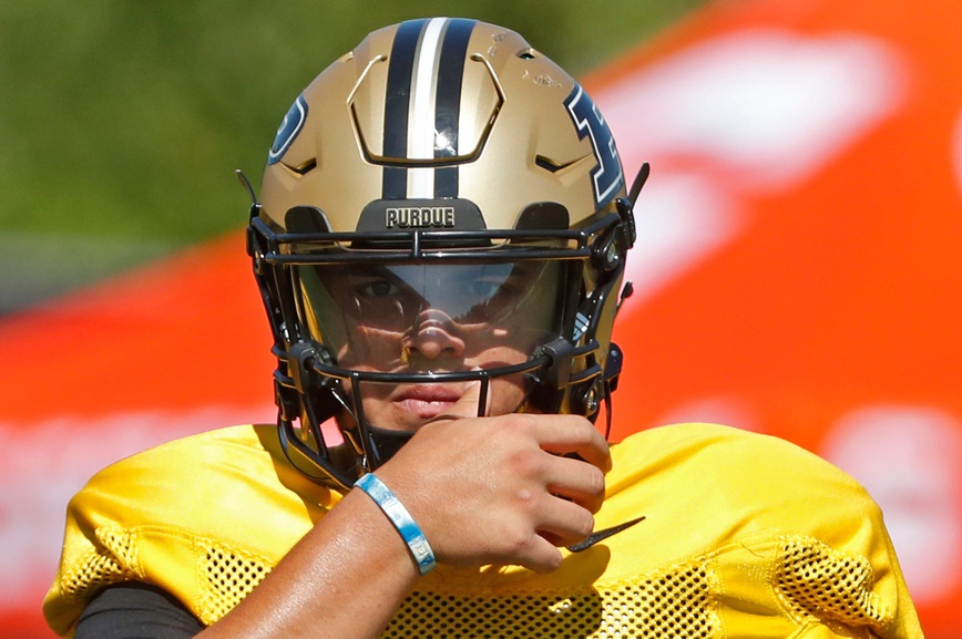 Purdue Boilermakers quarterback Marcos Davila (5) adjusts hit helmet Friday, Aug. 9, 2024, during Purdue football practice at Bimel Outdoor Practice Complex in West Lafayette, Ind.