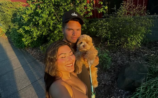 Dillon Gabriel and Zo Caswell with Winston (source: Dillon Gabriel's Instagram)
