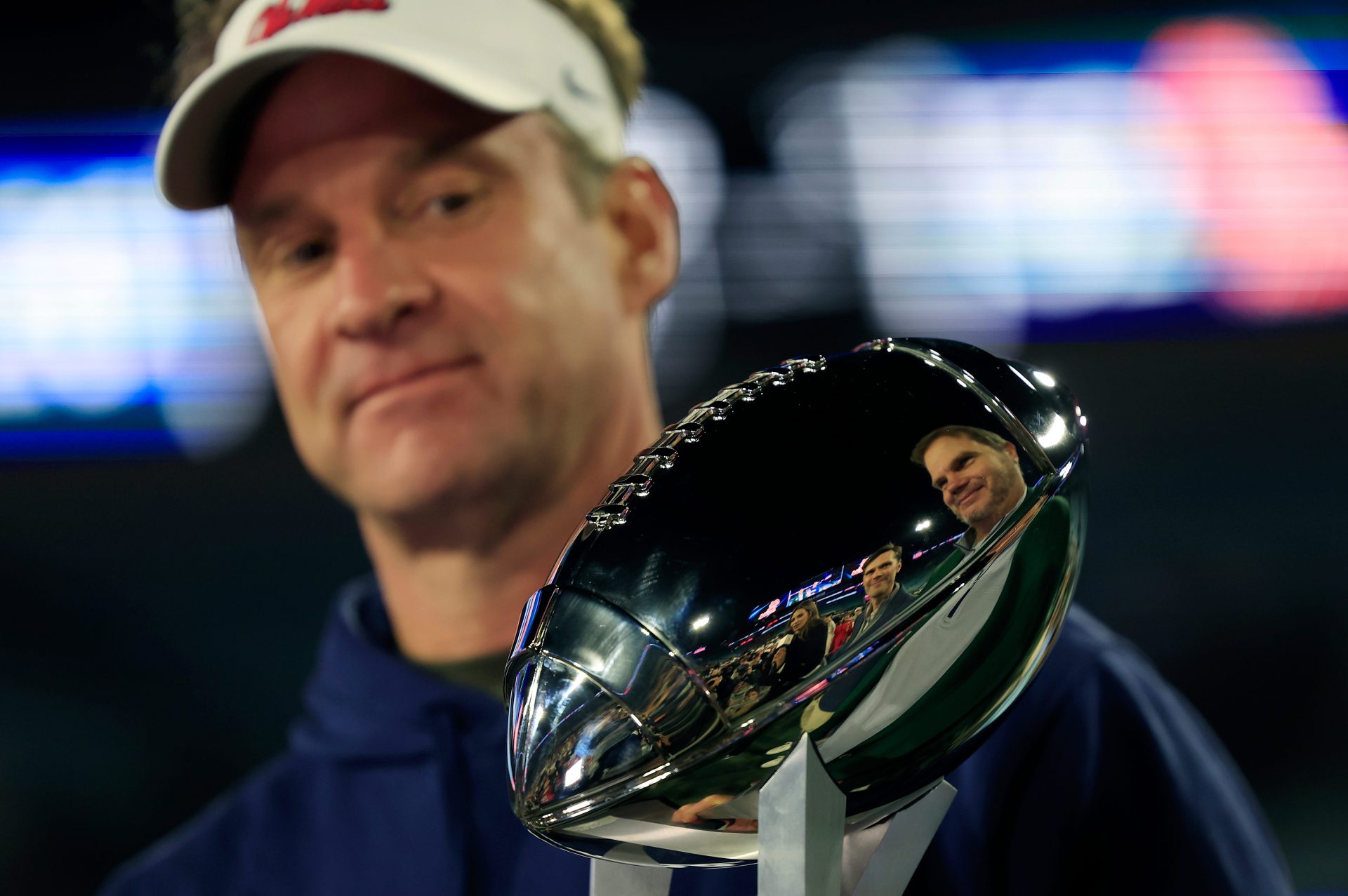 Mississippi Rebels head coach Lane Kiffin looks at the Ash Verlander Champions Trophy after the game of the TaxSlayer Gator Bowl Thursday, Jan. 2, 2025 at EverBank Stadium in Jacksonville, Fla. Ole Miss defeated Duke 52-20. [Corey Perrine/Florida Times-Union]