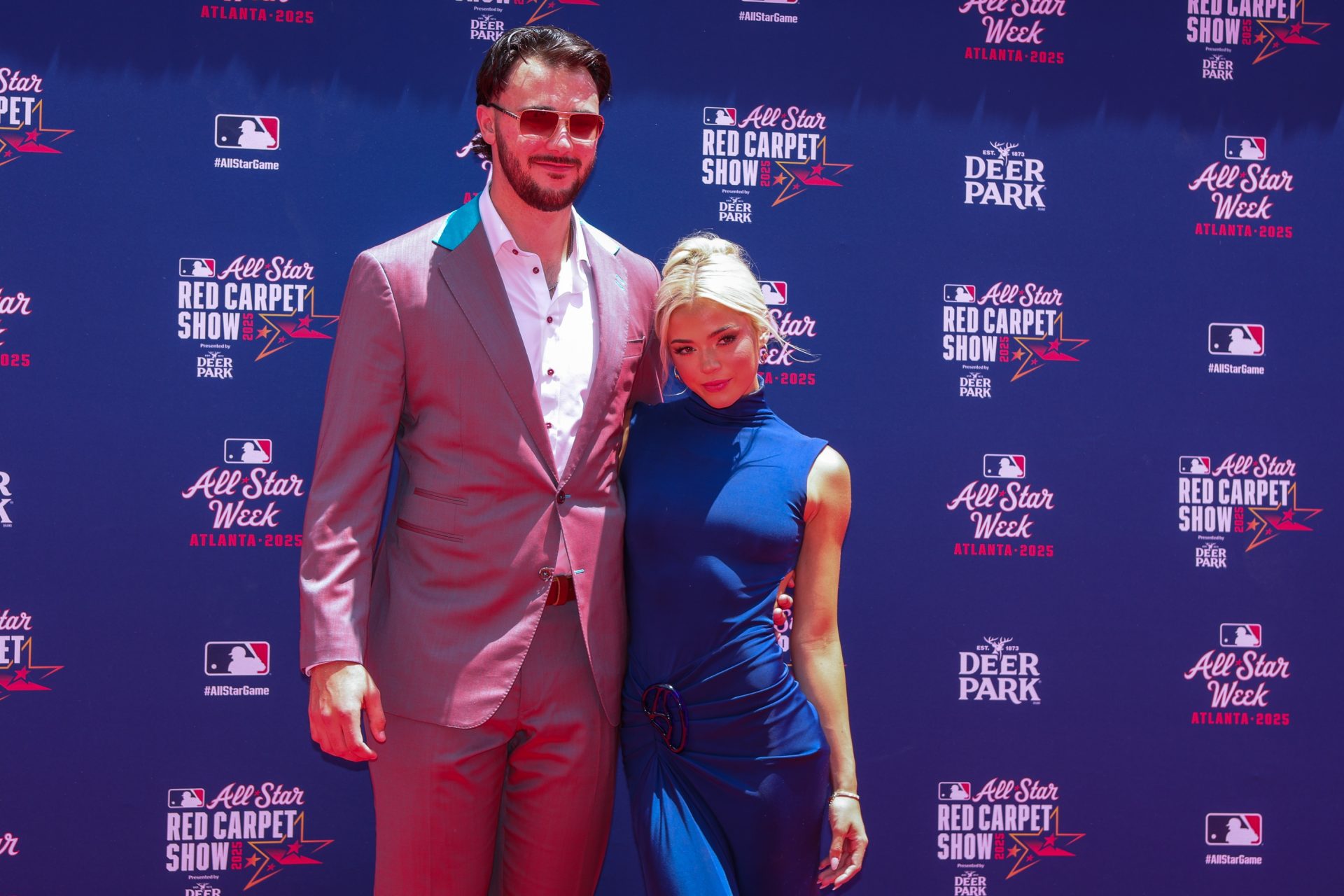 National League pitcher Paul Skenes (30) of the Pittsburgh Pirates and social media influencer Livvy Dunne pose for a photo on the red carpet before the 2025 MLB All Star Game at Truist Park.