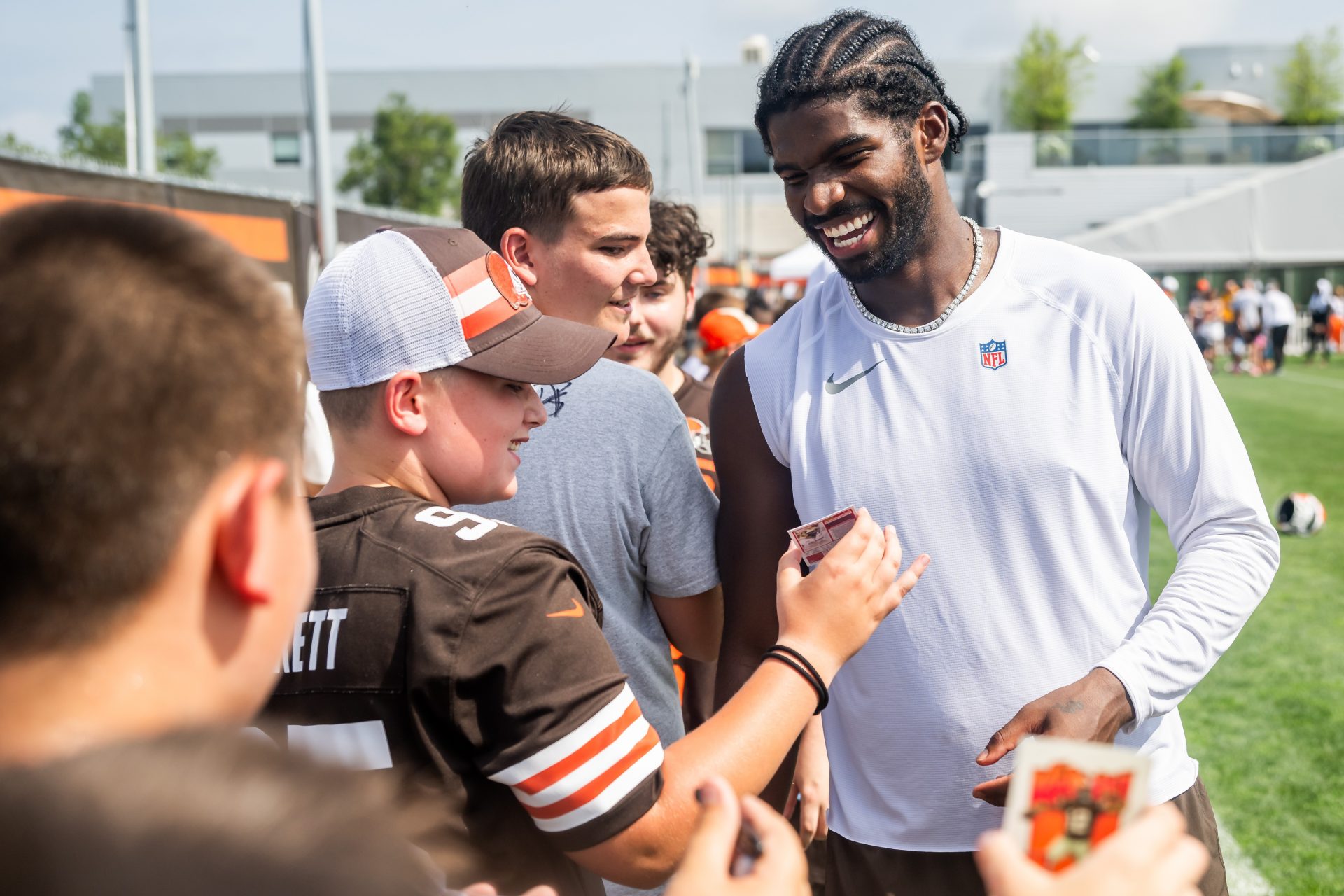 Cleveland Browns quarterback Shedeur Sanders (12) talks to a fan during training camp at CrossCountry Mortgage Campus.