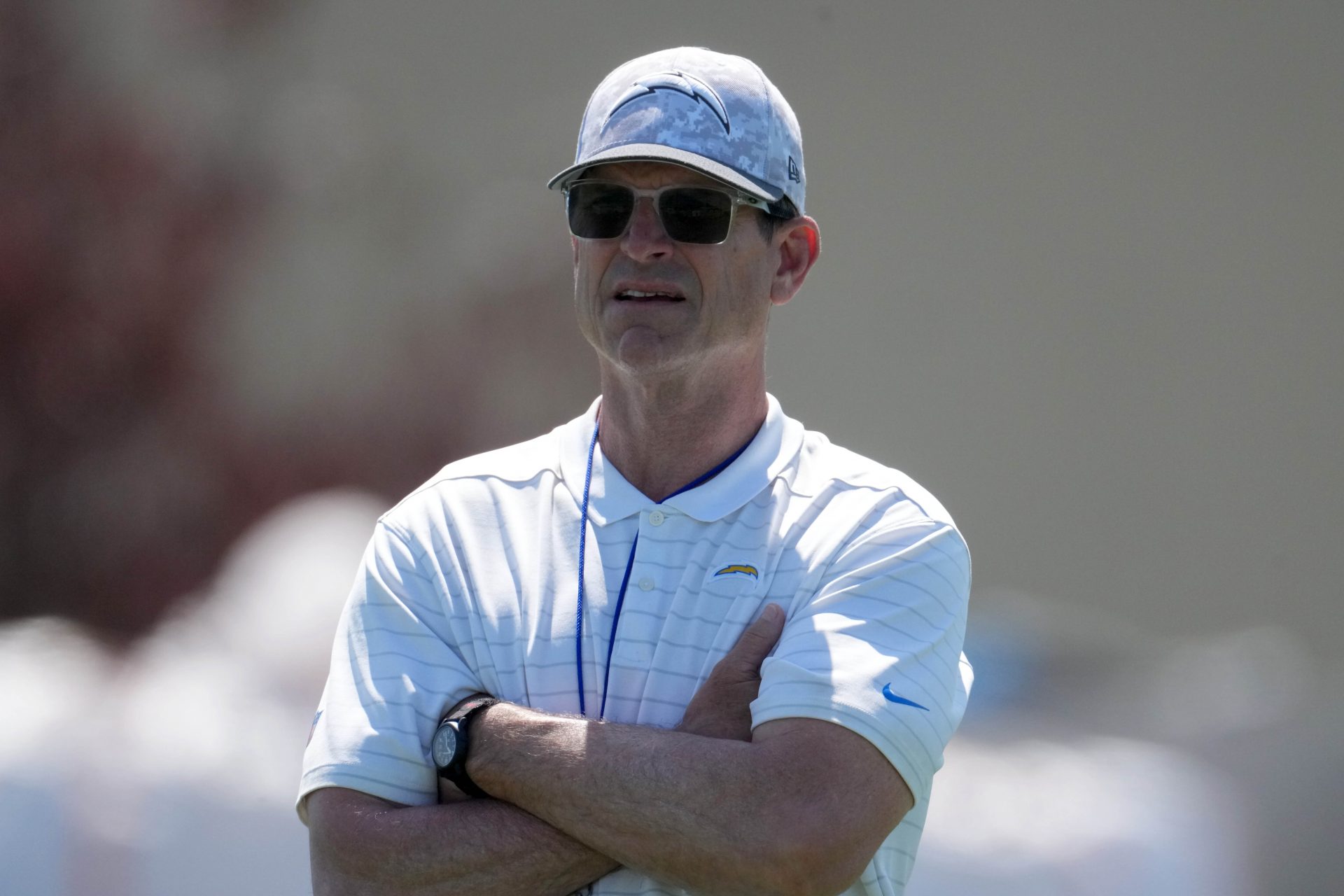Los Angeles Chargers coach Jim Harbaugh looks on during offseason workouts at The Bolt.
