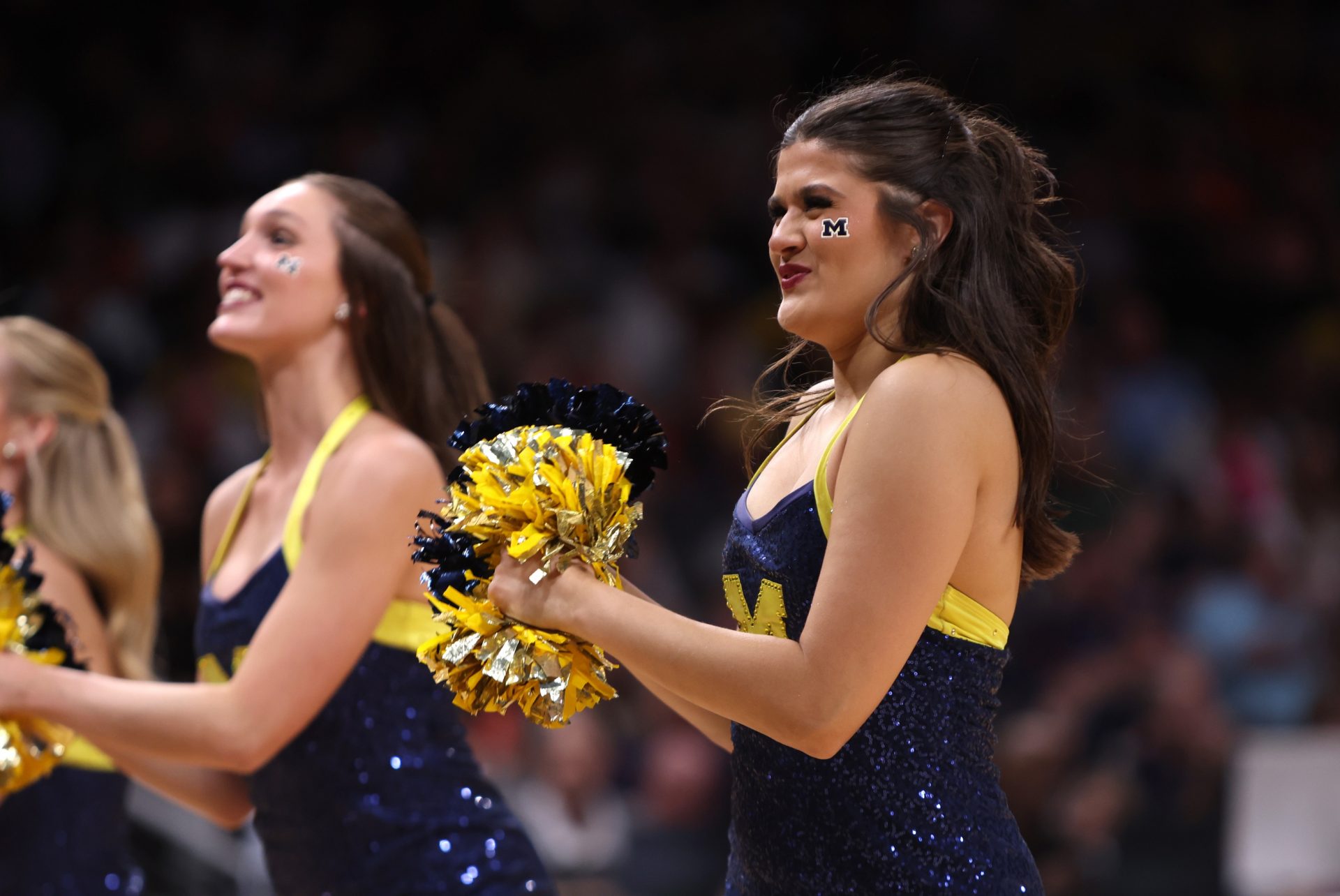 Michigan Wolverines cheerleaders in the second half of a South Regional semifinal of the 2025 NCAA tournament against the Auburn Tigers at State Farm Arena.