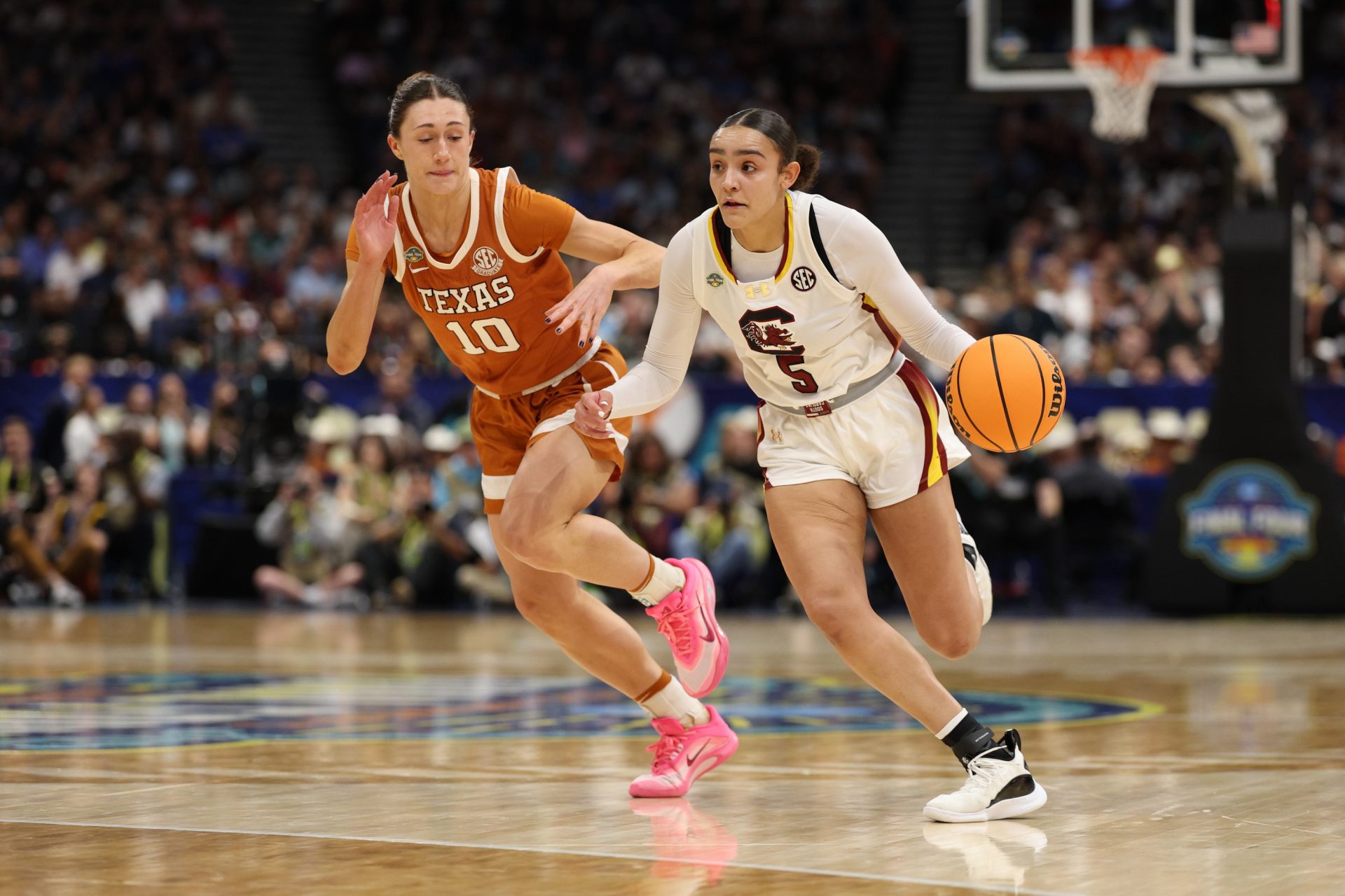 South Carolina Gamecocks guard Tessa Johnson (5) dribbles against Texas Longhorns guard Shay Holle (10) during the fourth quarter in the semifinal of the women's 2025 NCAA tournament at Amalie Arena.