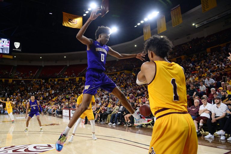 Washington Huskies forward Jaden McDaniels (0) defends an inbounds pass by Arizona State Sun Devils guard Remy Martin (1) during the second half at Desert Financial Arena.