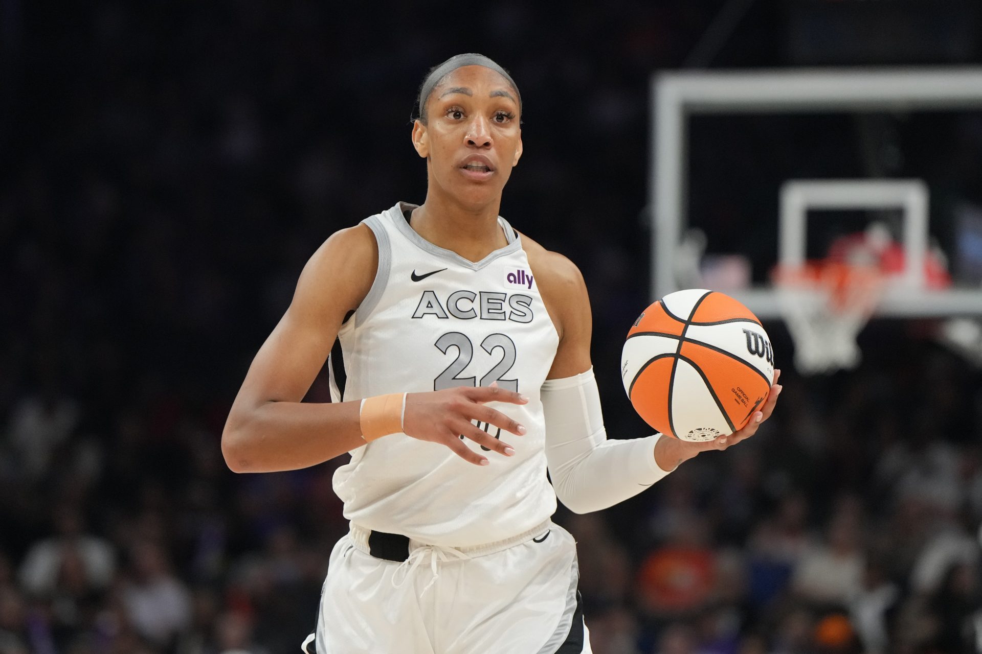 Las Vegas Aces center A'ja Wilson (22) brings the ball up court against the Phoenix Mercury in the first half at Footprint Center.