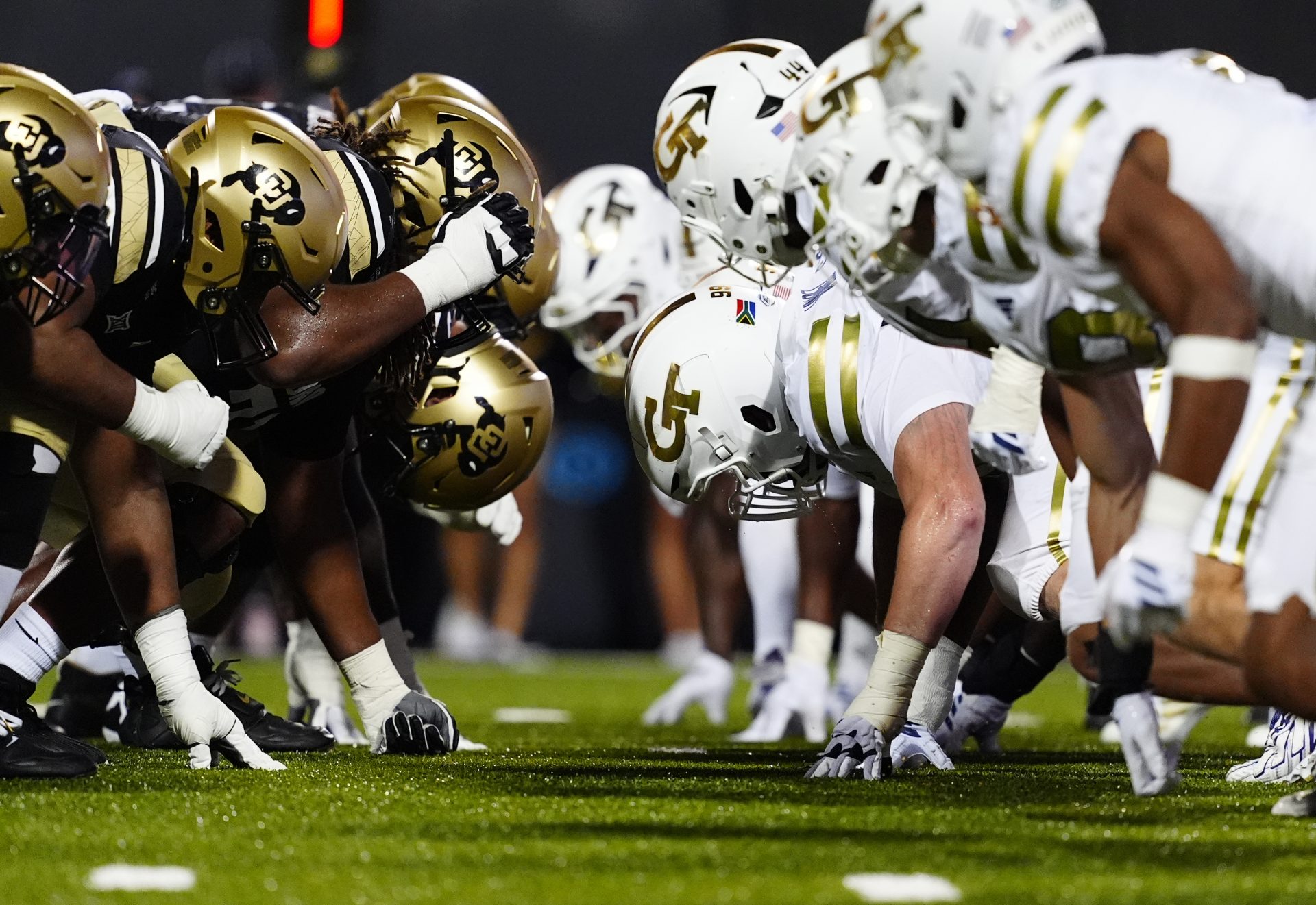 Members of the Colorado Buffaloes line across from the Georgia Tech Yellow Jackets during the fourth quarter at Folsom Field.
