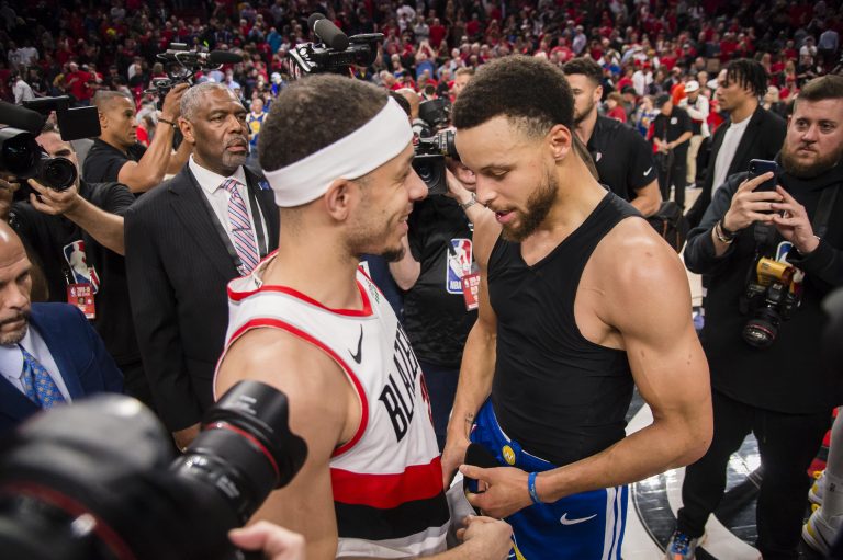 Portland Trail Blazers guard Seth Curry (31) meets with Golden State Warriors guard Stephen Curry (30) after game four of the Western conference finals of the 2019 NBA Playoffs at Moda Center. The Warriors won 119-117 in overtime.