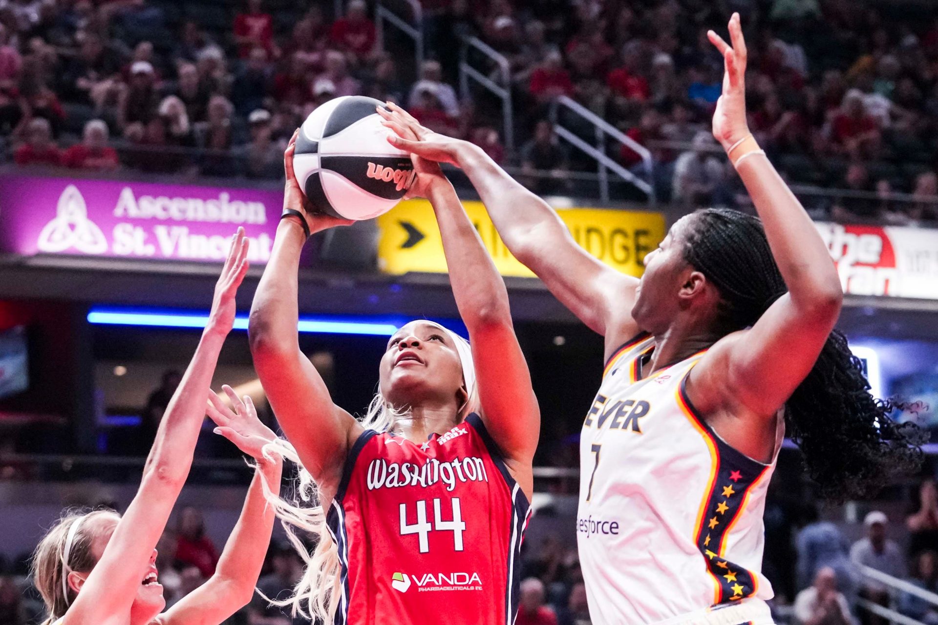 Indiana Fever guard Lexie Hull (10) and Indiana Fever forward Aliyah Boston (7) guard Washington Mystics forward Kiki Iriafen (44) on Tuesday, June 3, 2025, during a game between the Indiana Fever and the Washington Mystics at Gainbridge Fieldhouse in Indianapolis.