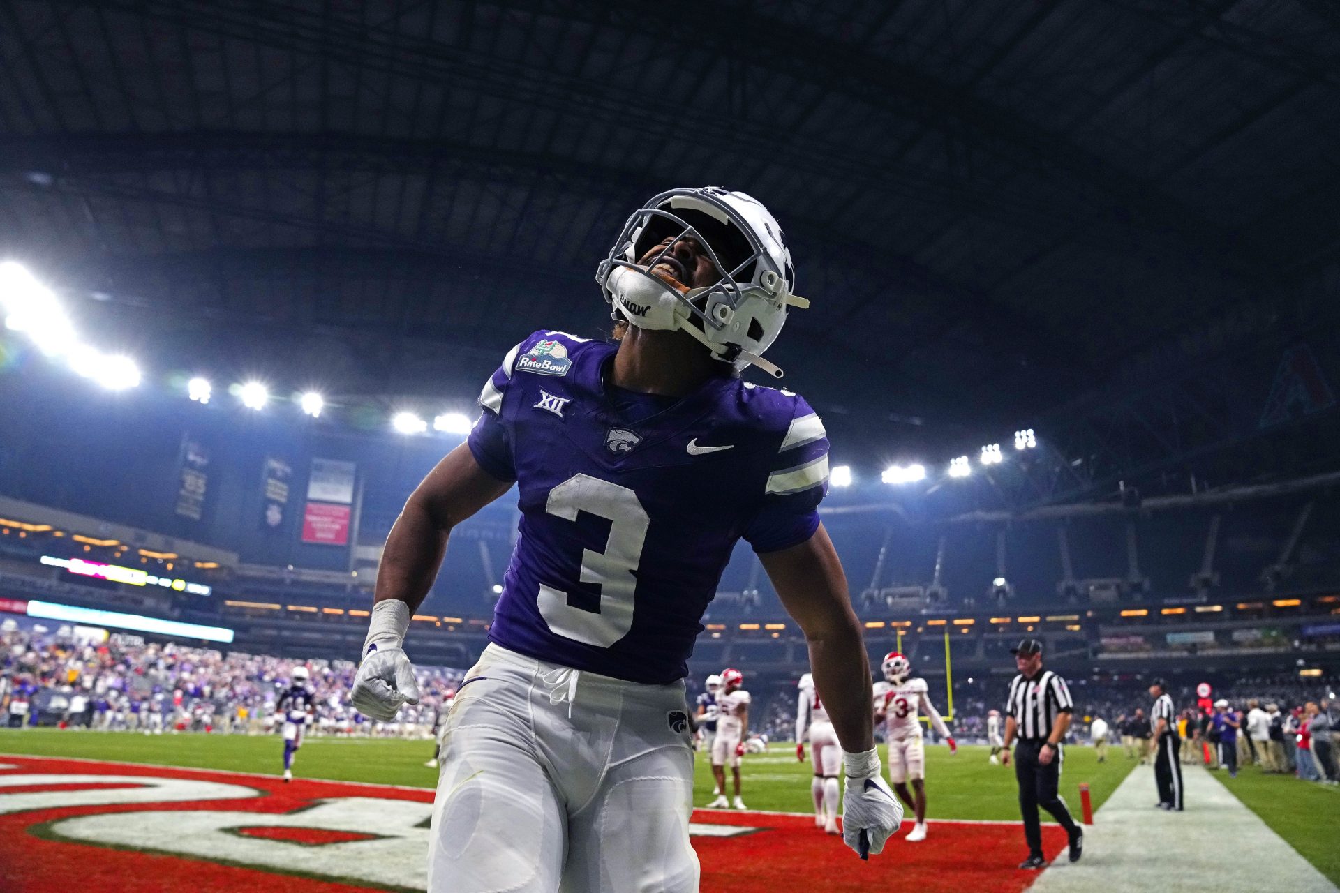 Kansas State running back Dylan Edwards (3) celebrates the go-ahead touchdown against Rutgers during the second half of the Rate Bowl at Chase Field on Dec. 26, 2024, in Phoenix.