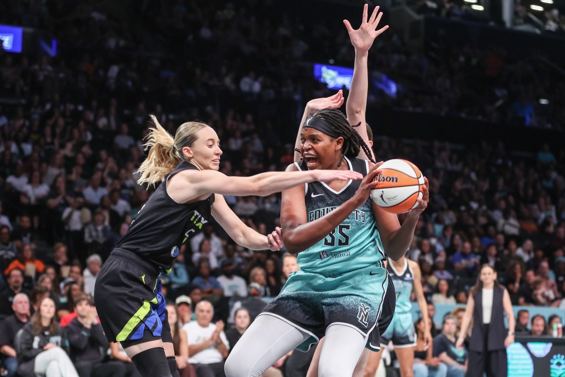 Dallas Wings guard Paige Bueckers (5) and New York Liberty center Jonquel Jones (35) fight for a loose ball in the third quarter at Barclays Center.