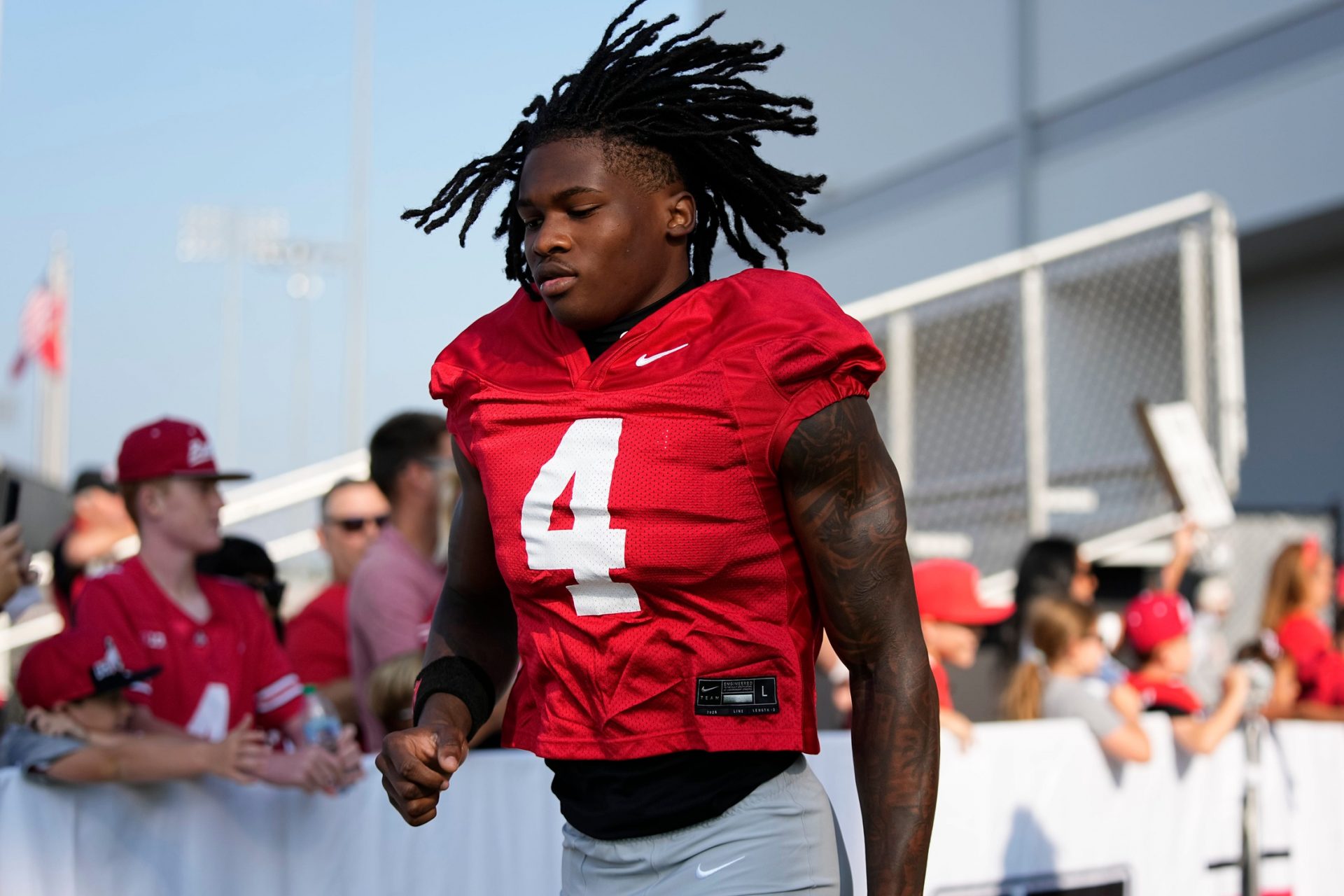 Ohio State Buckeyes wide receiver Jeremiah Smith (4) takes the field for football training camp at the Woody Hayes Athletic Center on Aug. 1, 2025.
