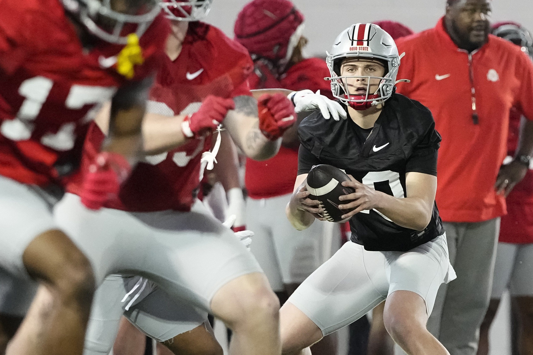 Ohio State Buckeyes quarterback Julian Sayin (10) takes a snap during spring football practice at the Woody Hayes Athletic Center on March 17, 2025.