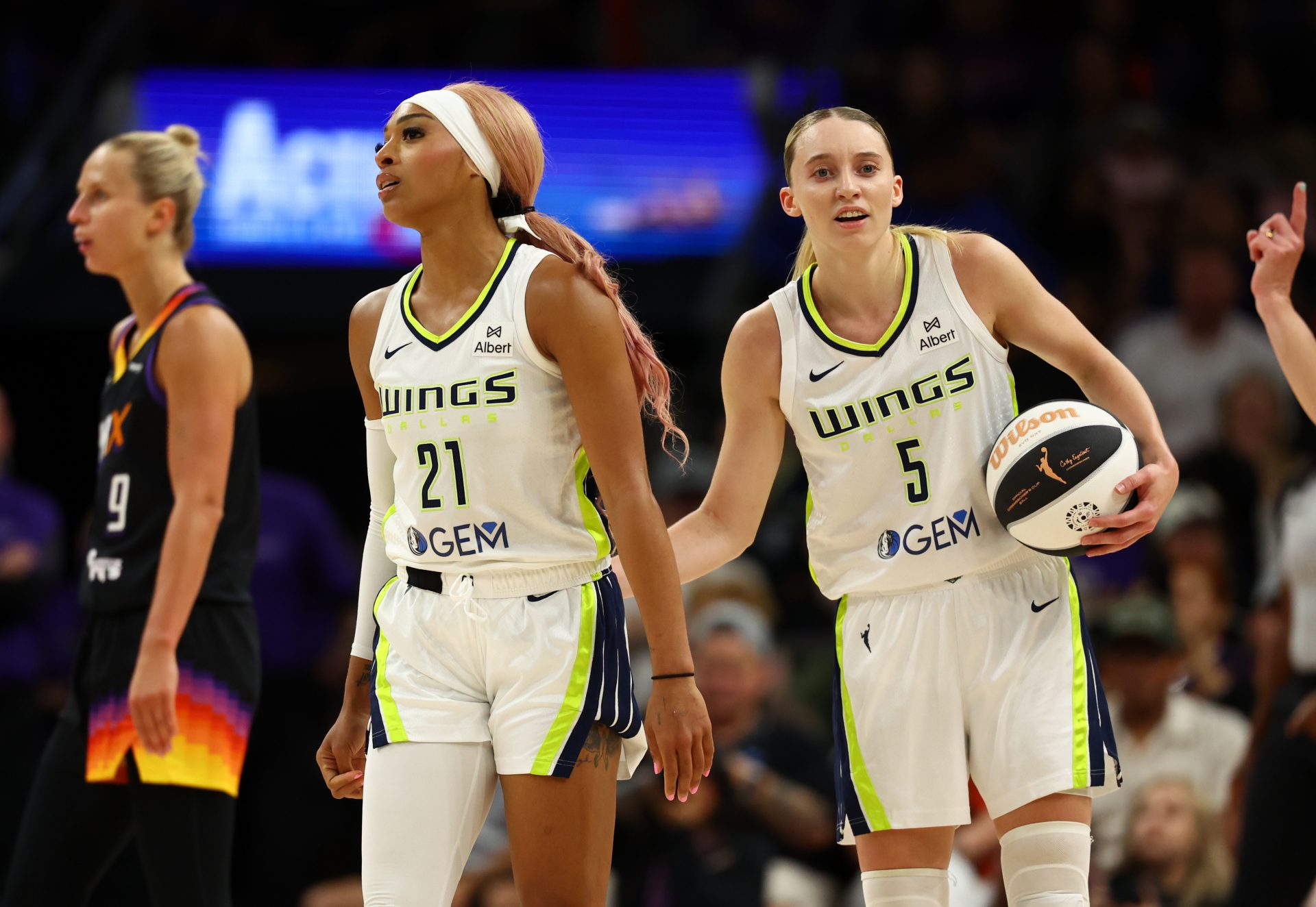 Dallas Wings guard DiJonai Carrington (21) with Paige Bueckers (5) against the Phoenix Mercury at PHX Arena.