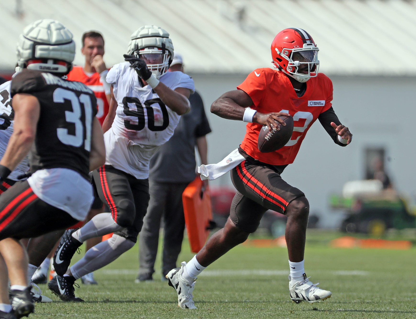 Cleveland Browns quarterback Shedeur Sanders (12) runs for a short gain during NFL training camp at CrossCountry Mortgage Campus, Wednesday, July 30, 2025, in Berea, Ohio.