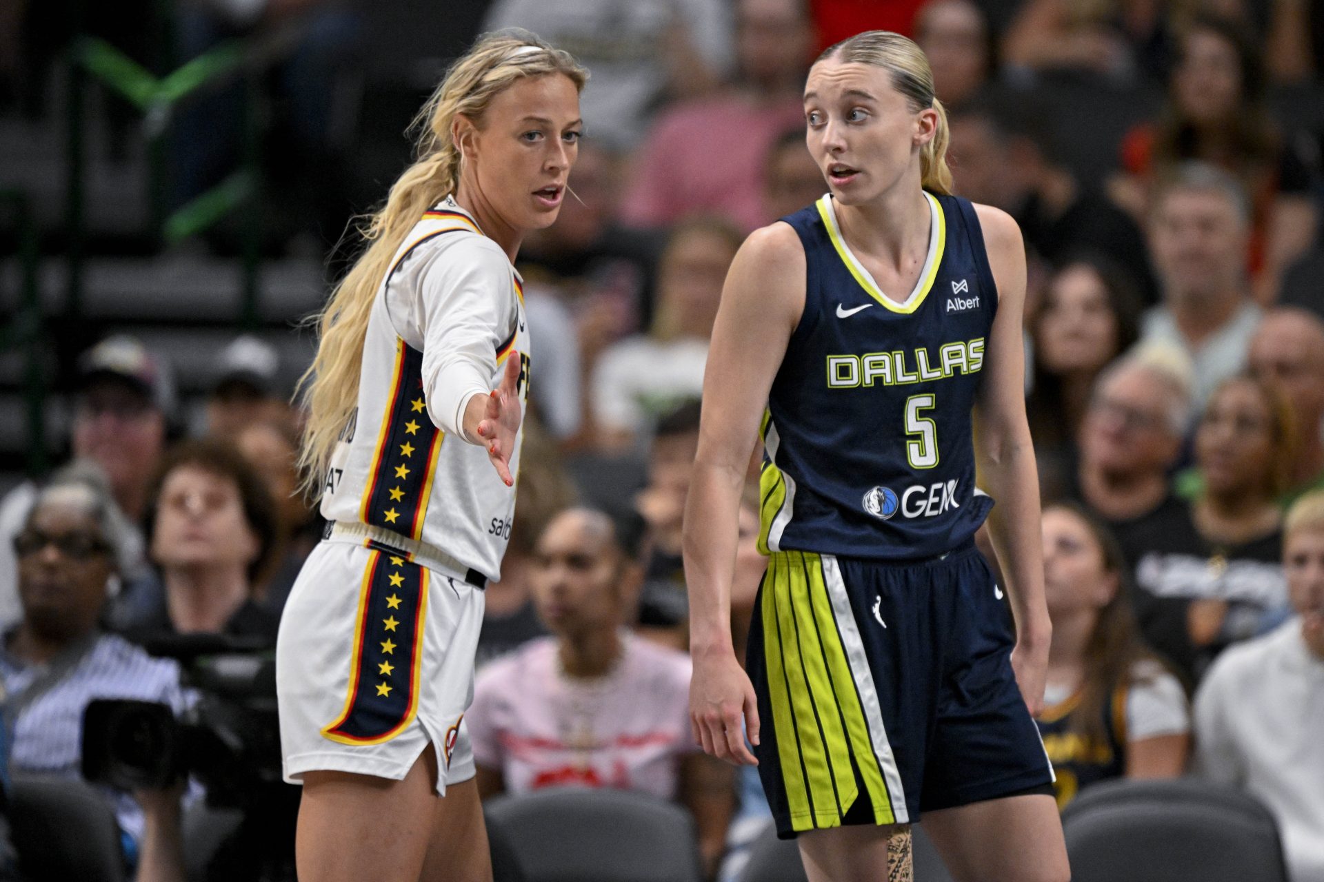 Dallas Wings guard Paige Bueckers (5) and Indiana Fever guard Sophie Cunningham (8) in action during the game between the Dallas Wings and the Indiana Fever at the American Airlines Center.