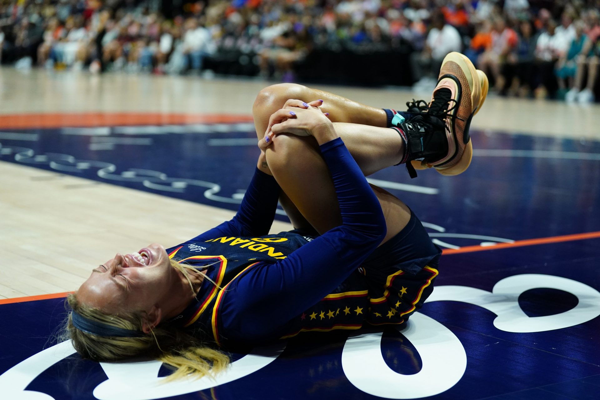 Indiana Fever guard Sophie Cunningham (8) on the court injured as they take on the Connecticut Sun in the first half at Mohegan Sun Arena.