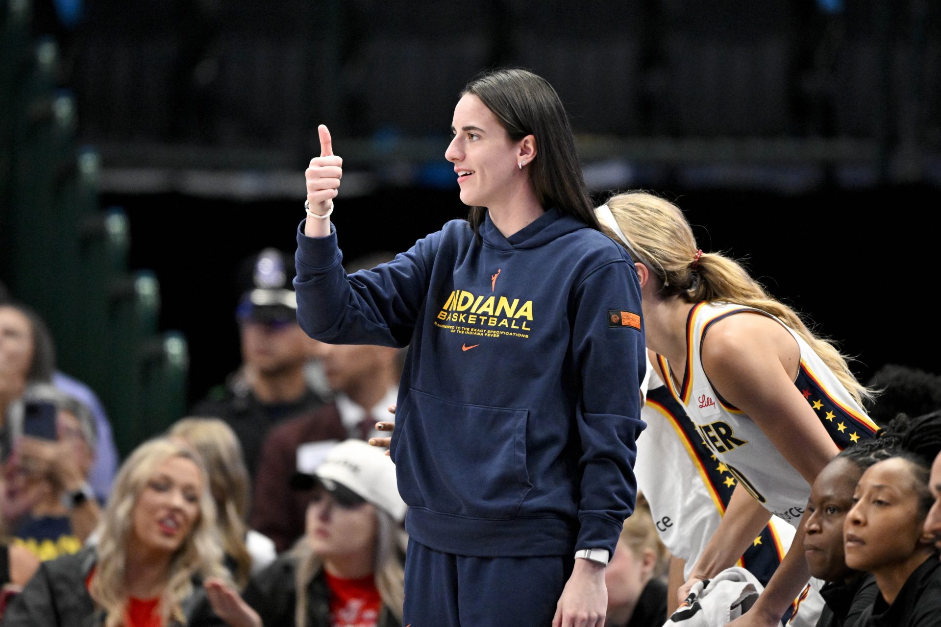 Indiana Fever guard Caitlin Clark (22) gives a thumbs up during the first half against the Dallas Wings at the American Airlines Center.
