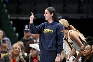Indiana Fever guard Caitlin Clark (22) gives a thumbs up during the first half against the Dallas Wings at the American Airlines Center.