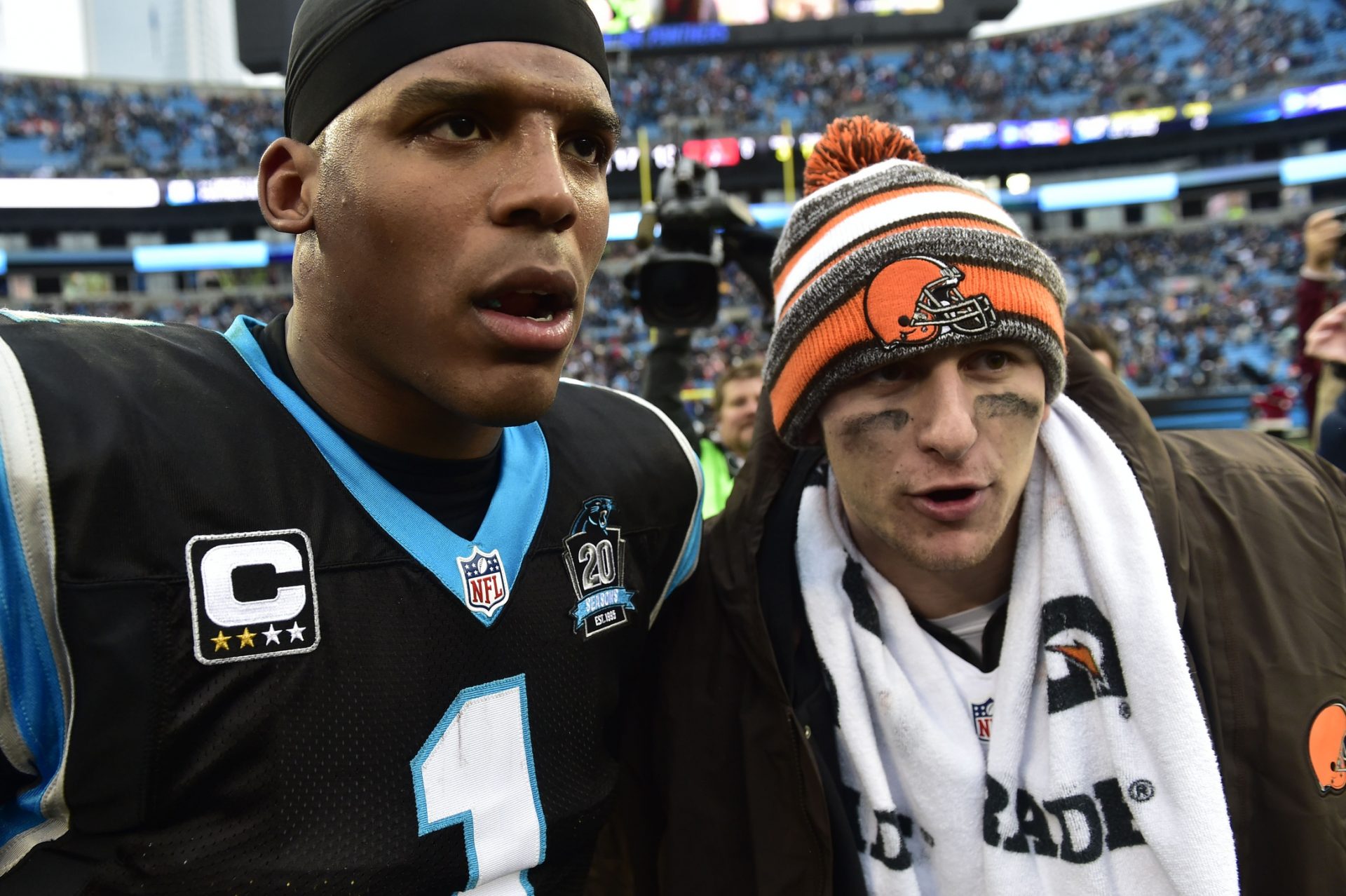 Carolina Panthers quarterback Cam Newton (1) with Cleveland Browns quarterback Johnny Manziel (2) after the game. The Panthers defeated the Browns 17-13 at Bank of America Stadium.
