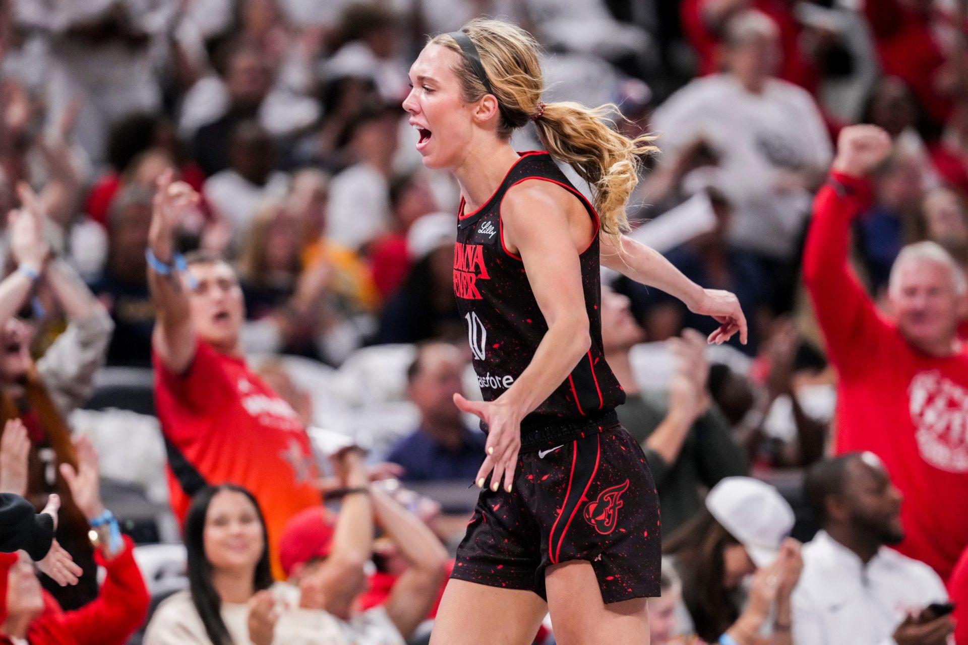 Indiana Fever guard Lexie Hull (10) celebrates a 3-pointer Tuesday, Aug. 26, 2025, during a game between the Indiana Fever and the Seattle Storm at Gainbridge Fieldhouse in Indianapolis.