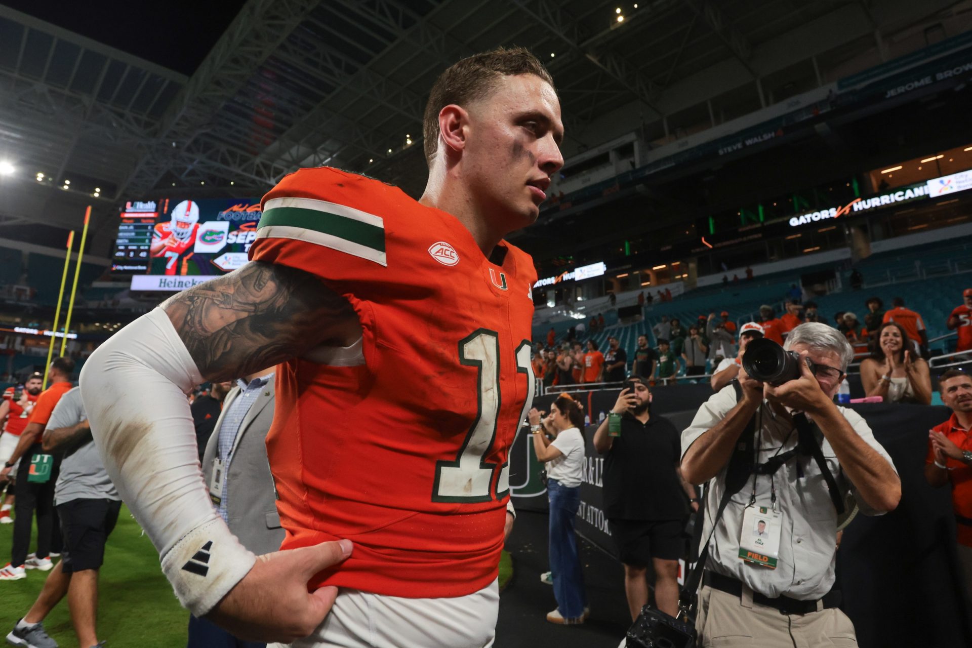 Miami Hurricanes quarterback Carson Beck (11) walks off the field after the game against the South Florida Bulls at Hard Rock Stadium.