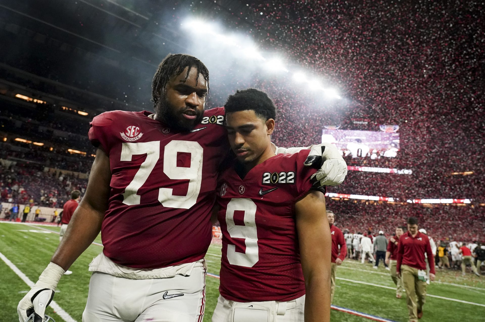 Alabama offensive lineman Chris Owens (79) and Alabama quarterback Bryce Young (9) leave the field after the 2022 CFP college football national championship game at Lucas Oil Stadium. Georgia defeated Alabama 33-18.