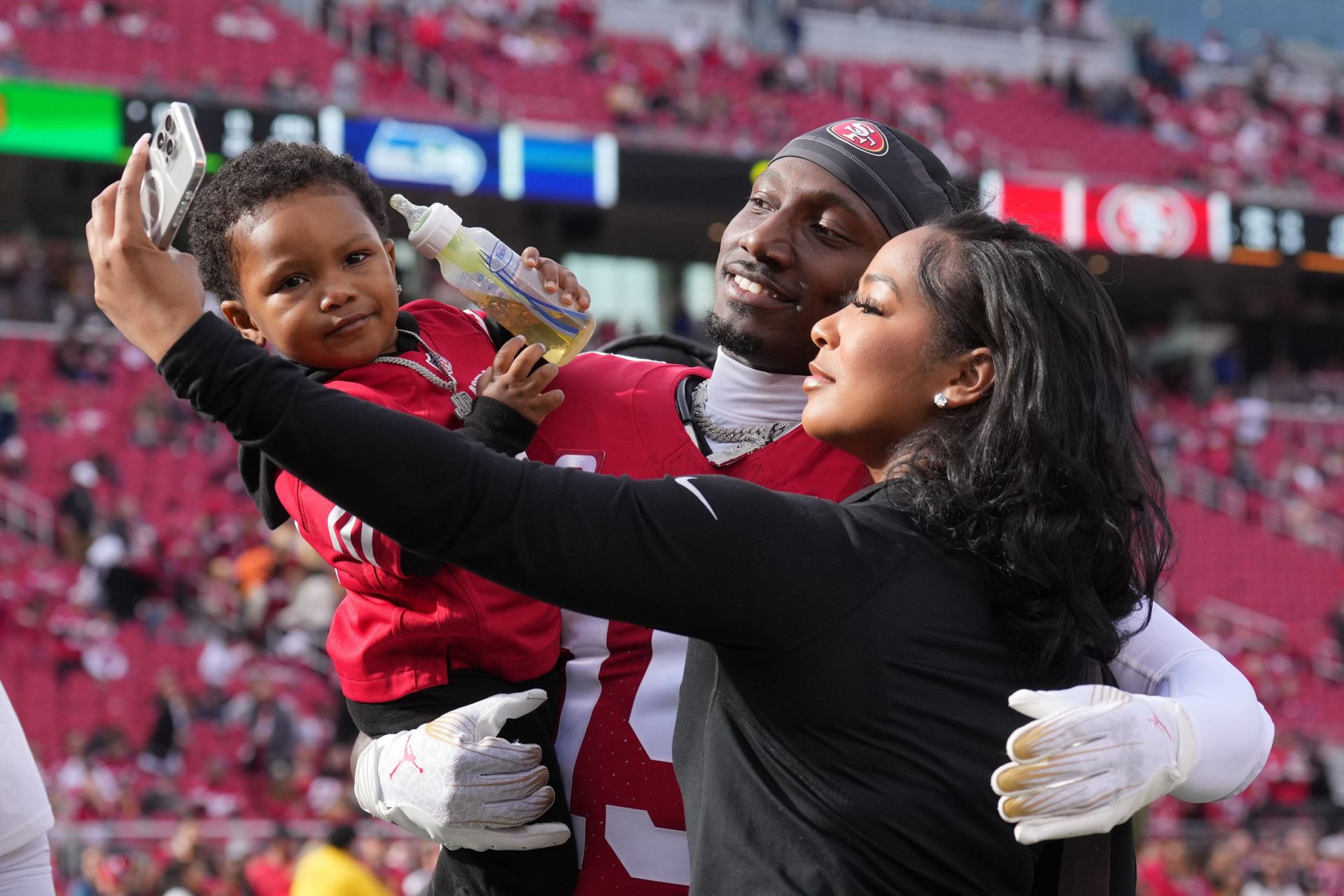 San Francisco 49ers wide receiver Deebo Samuel (19) takes a selfie with his son, Tyshun, and girlfriend, Mahogany Jones, before the game against the Seattle Seahawks at Levi's Stadium.