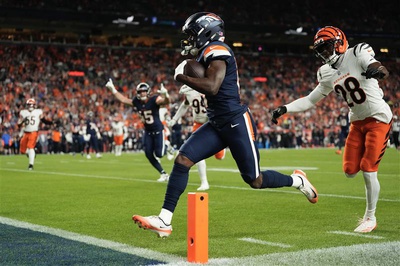 Broncos running back Marvin Mims Jr. scores a touchdown against the Bengals.
