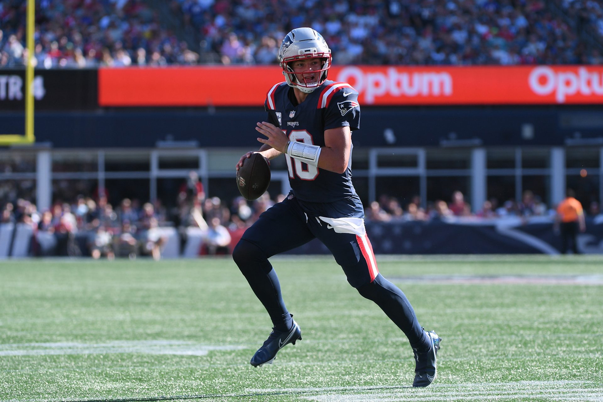 New England Patriots quarterback Drake Maye (10) rolls out of the pocket during the second half against the Carolina Panthers at Gillette Stadium.