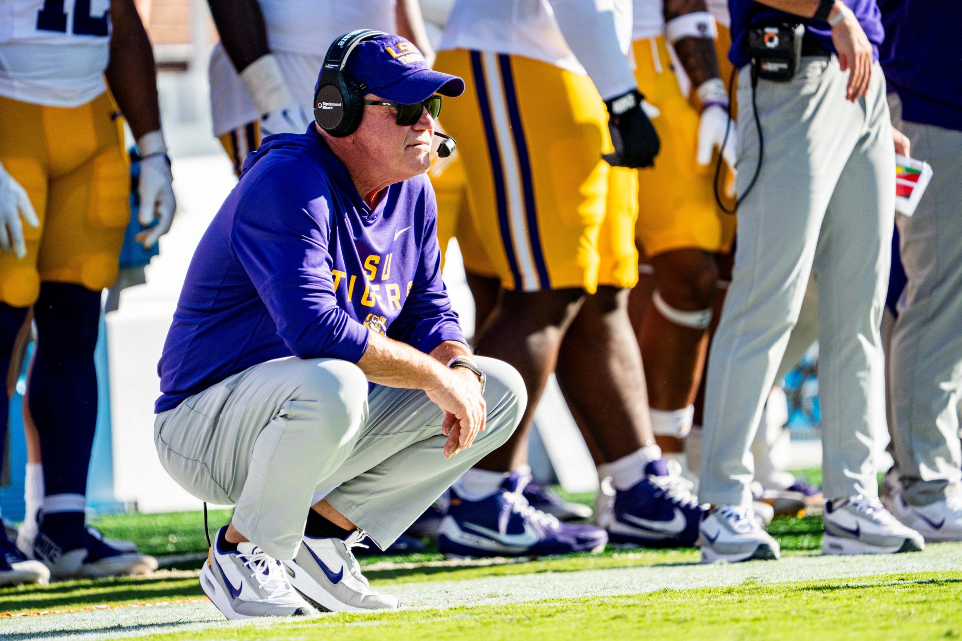 LSU head coach Brian Kelly crouches on the sidelines during a college football game between Ole Miss and LSU at Vaught-Hemingway Stadium in Oxford, Miss., on Saturday, Sept. 27, 2025.