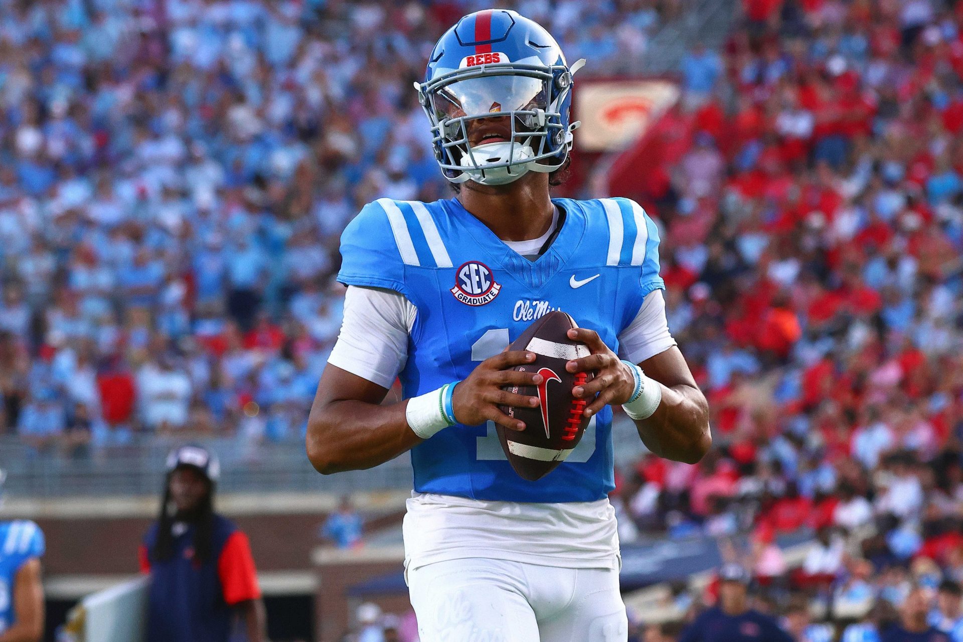 Mississippi Rebels quarterback Austin Simmons (13) warm ups between the first and second quarters against the Arkansas Razorback at Vaught-Hemingway Stadium.