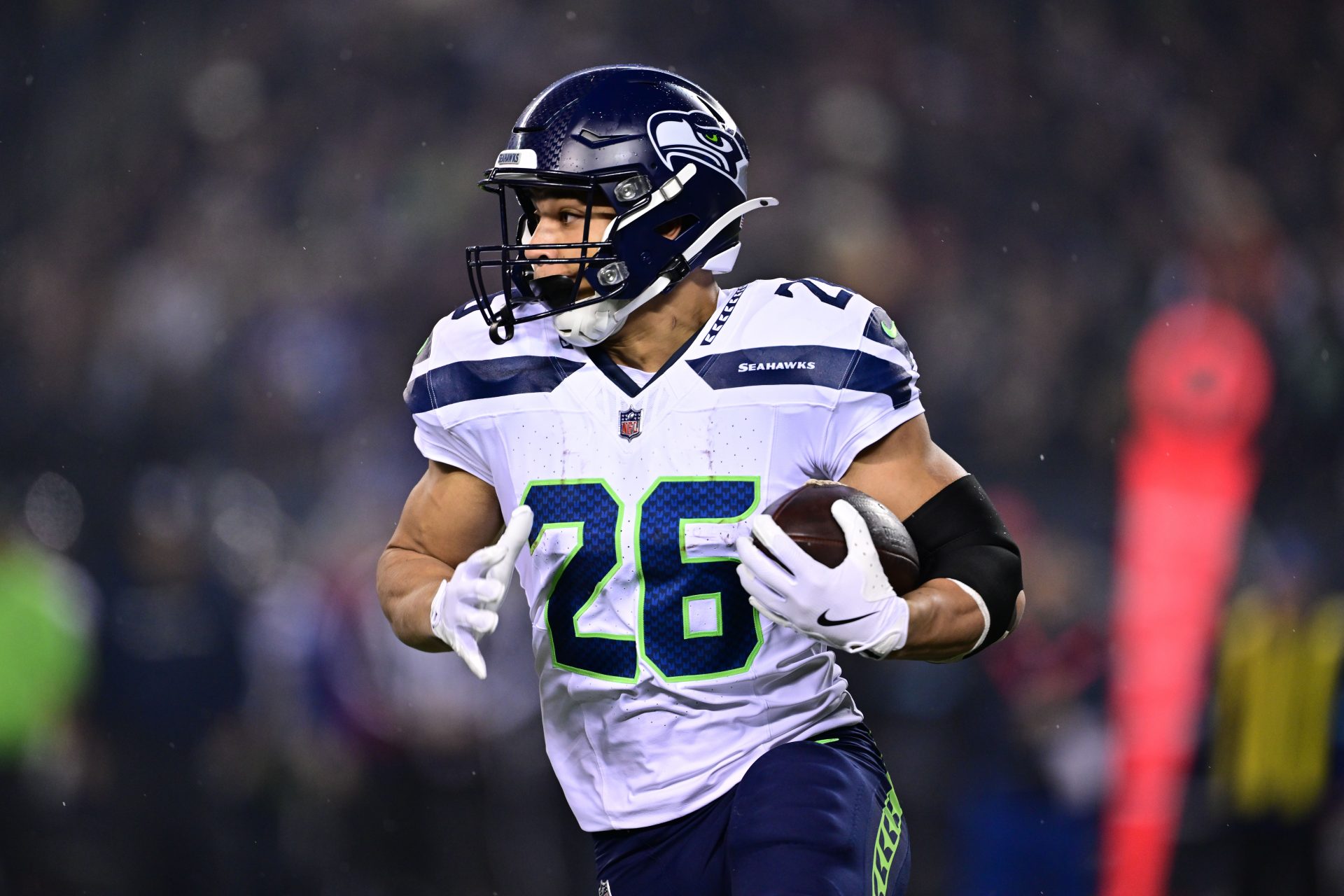 Seattle Seahawks running back Zach Charbonnet (26) runs the ball against the Chicago Bears during the first quarter at Soldier Field.