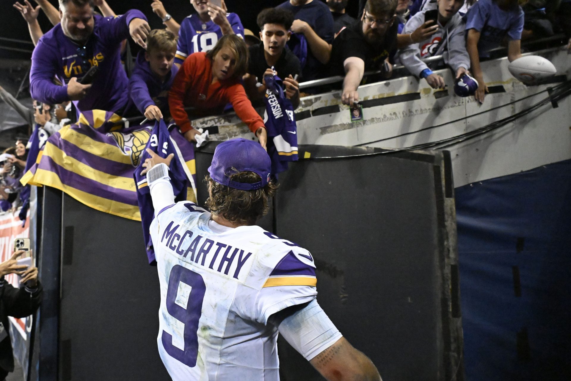 Minnesota Vikings quarterback J.J. McCarthy (9) reacts after defeating the Chicago Bears at Soldier Field.