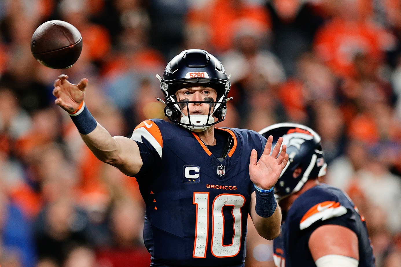 Denver Broncos quarterback Bo Nix (10) throws a pass during the third quarter against the Cincinnati Bengals at Empower Field at Mile High.