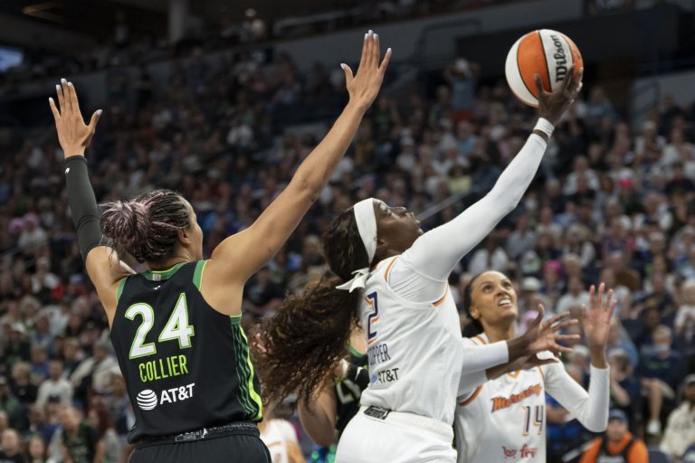 Phoenix Mercury guard Kahleah Copper (2) drives to the basket and shoots ht ball past Minnesota Lynx forward Napheesa Collier (24) in the second half during game one of the second round for the 2025 WNBA Playoffs at Target Center.