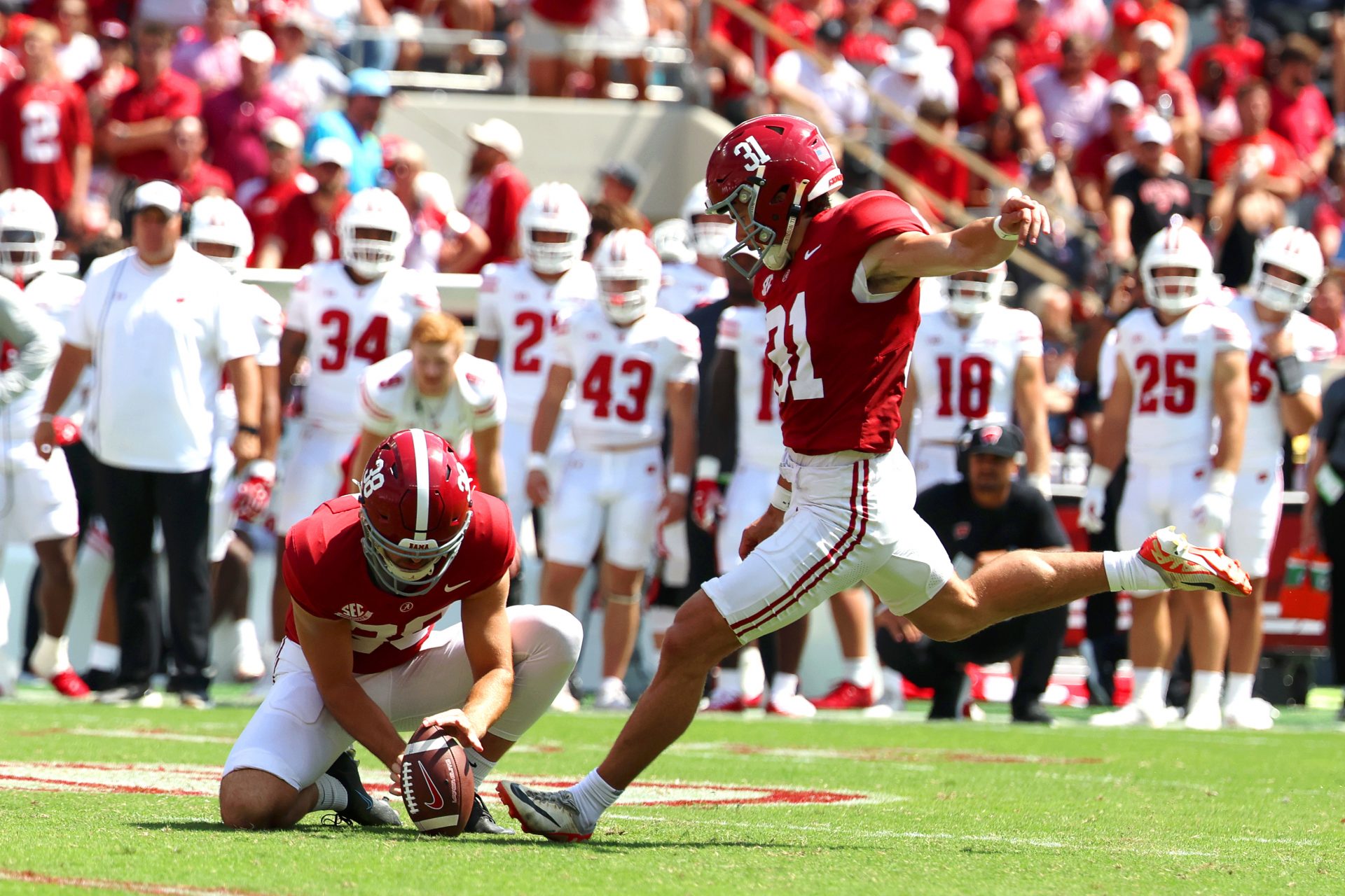 Alabama Crimson Tide kicker Conor Talty (31) kicks a field goal during the second half against the Wisconsin Badgers at Saban Field at Bryant-Denny Stadium.