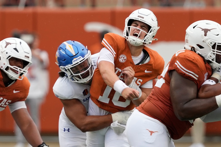 Texas Longhorns quarterback Arch Manning (16) reacts after getting hit by San Jose State Spartans linebacker Taniela Latu (4) during the second half at Darrell K Royal-Texas Memorial Stadium.