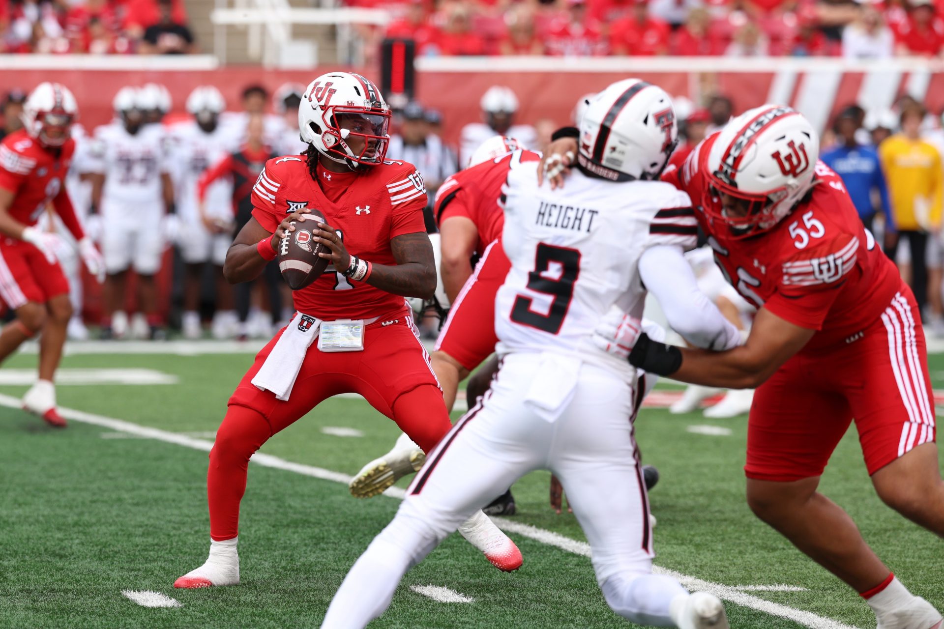 Utah Utes quarterback Devon Dampier (4) looks to pass the ball against the Texas Tech Red Raiders during the first quarter at Rice-Eccles Stadium.