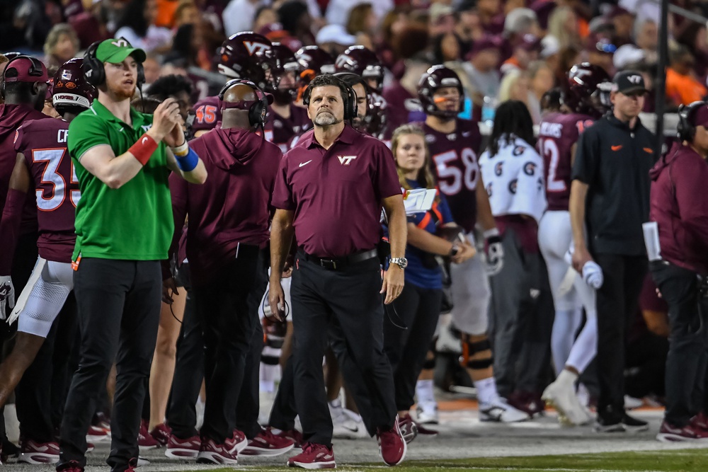 Virginia Tech Hokies head coach Brent Pry looks at the scoreboard during the second quarter at Lane Stadium.