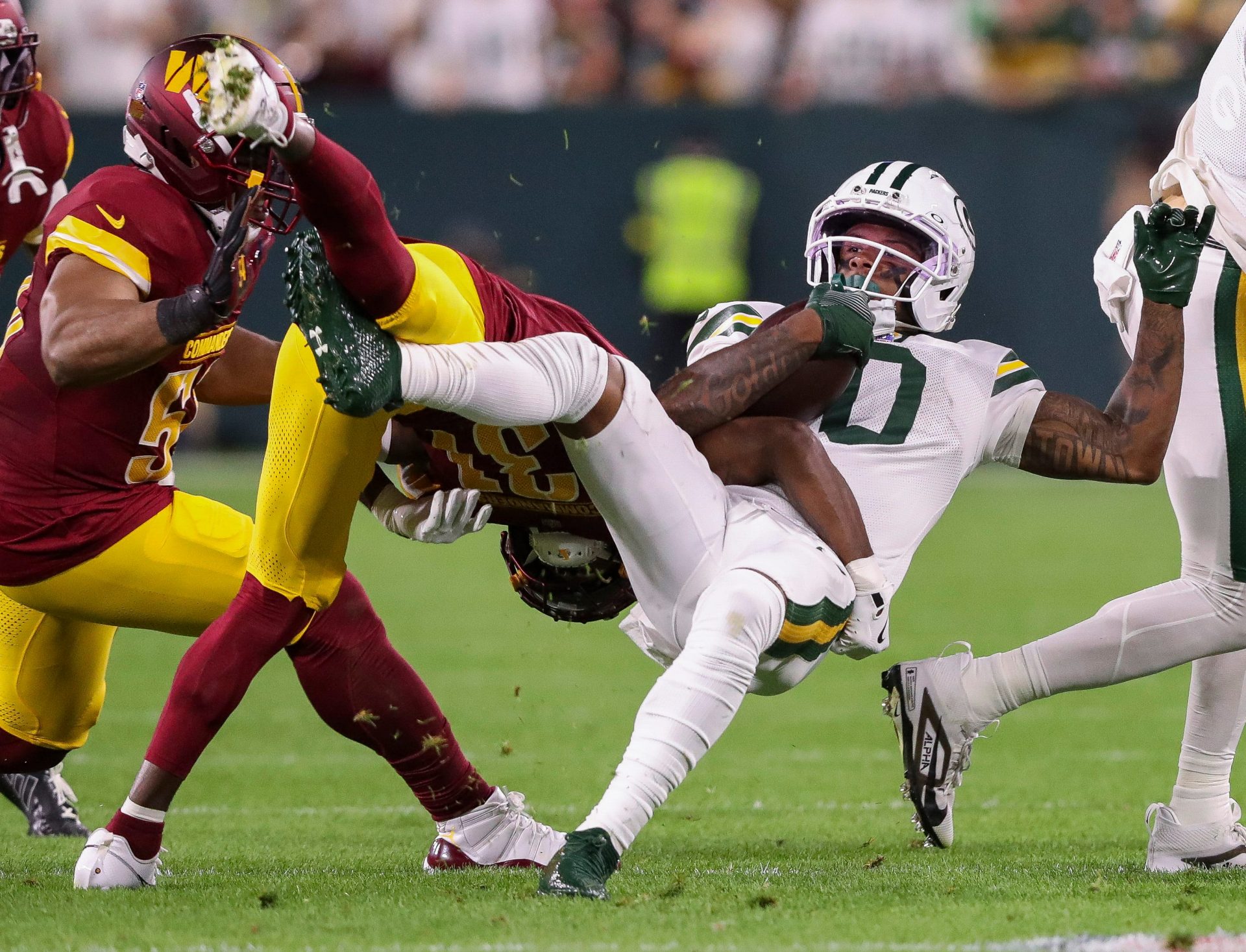 Green Bay Packers wide receiver Matthew Golden (0) is tackled by Washington Commanders cornerback Jonathan Jones (31) on Thursday, September 11, 2025, at Lambeau Field in Green Bay, Wis. The Packers won the game, 27-18.
Tork Mason/USA TODAY NETWORK-Wisconsin