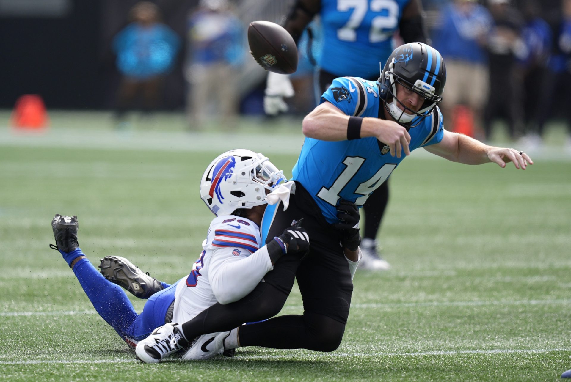 Buffalo Bills defensive end Greg Rousseau (50) causes a fumble by Carolina Panthers quarterback Andy Dalton (14) during the first half at Bank of America Stadium.