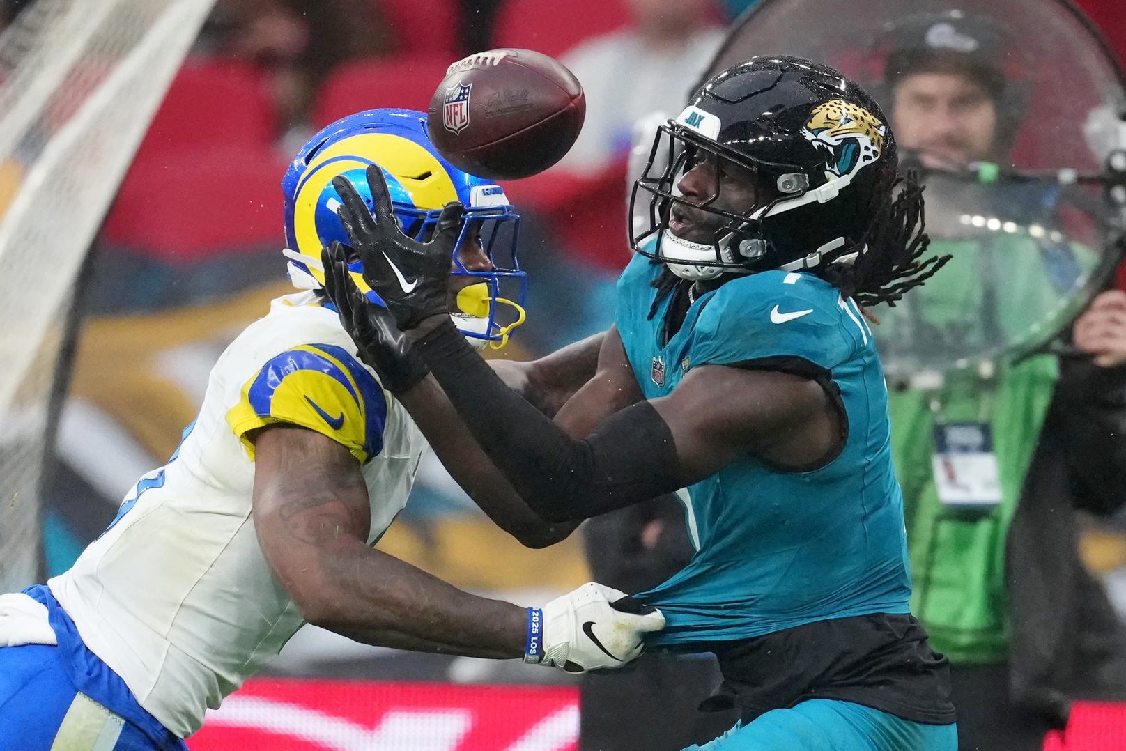 Los Angeles Rams safety Kam Curl (3) breaks up a pass intended for Jacksonville Jaguars wide receiver Brian Thomas Jr. (7) during the second half of an NFL International Series game at Wembley Stadium.
