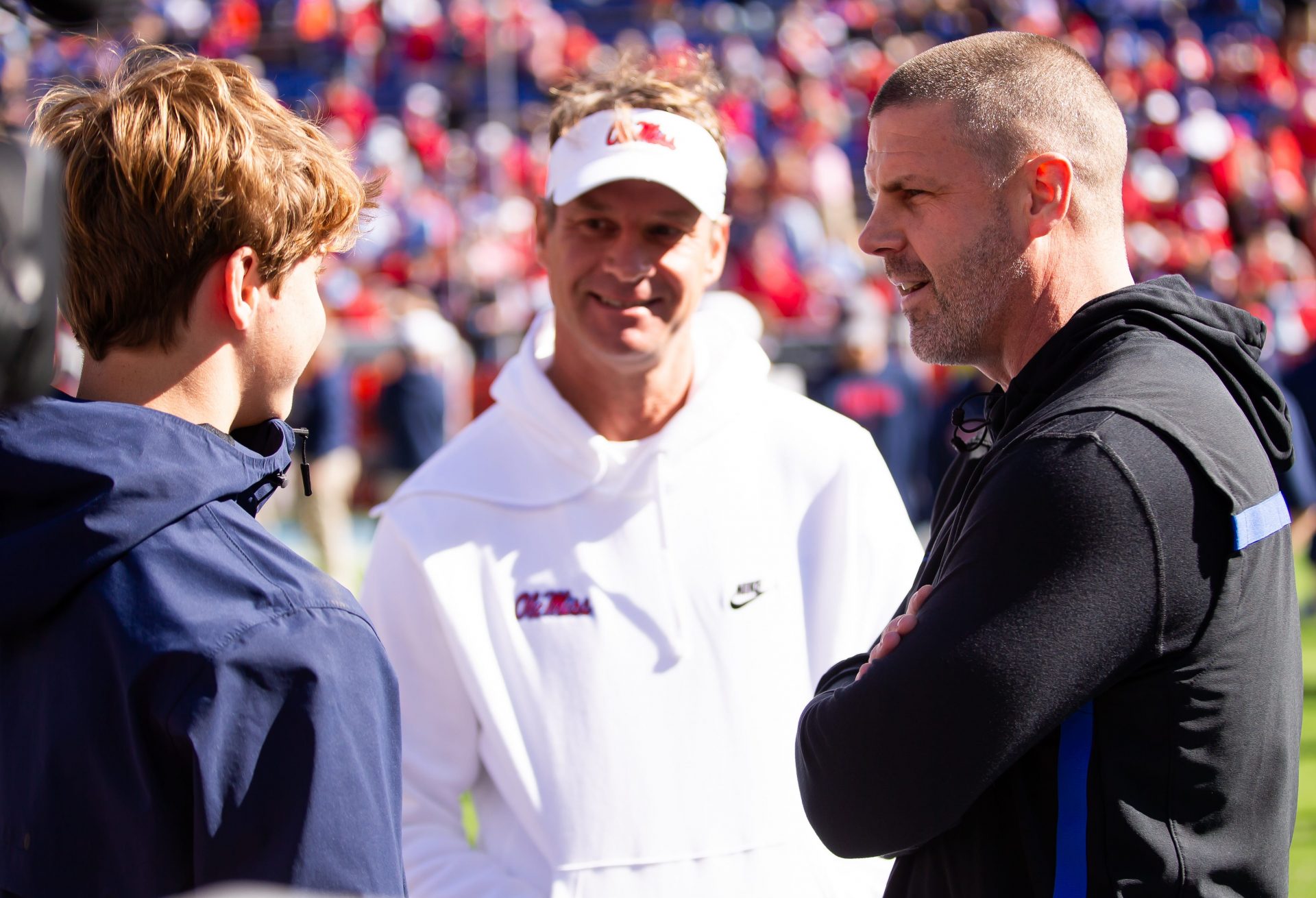 Florida Gators head coach Billy Napier talks with Mississippi Rebels head coach Lane Kiffin before the start of the game at Ben Hill Griffin Stadium in Gainesville, FL on Saturday, November 23, 2024. [Doug Engle/Gainesville Sun]