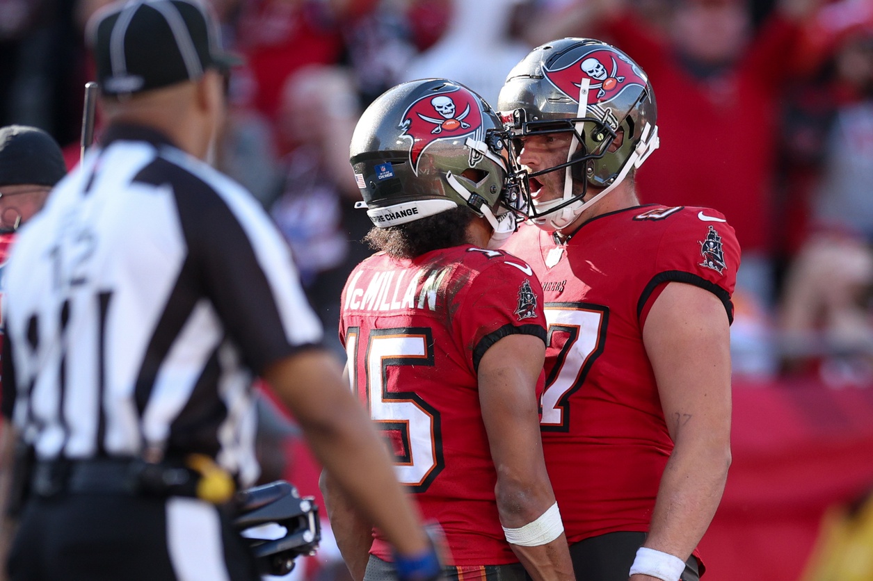 Tampa Bay Buccaneers wide receiver Jalen McMillan (15) calibrates with tight end Payne Durham (87) after scoring a touchdown against the New Orleans Saints in the fourth quarter at Raymond James Stadium.