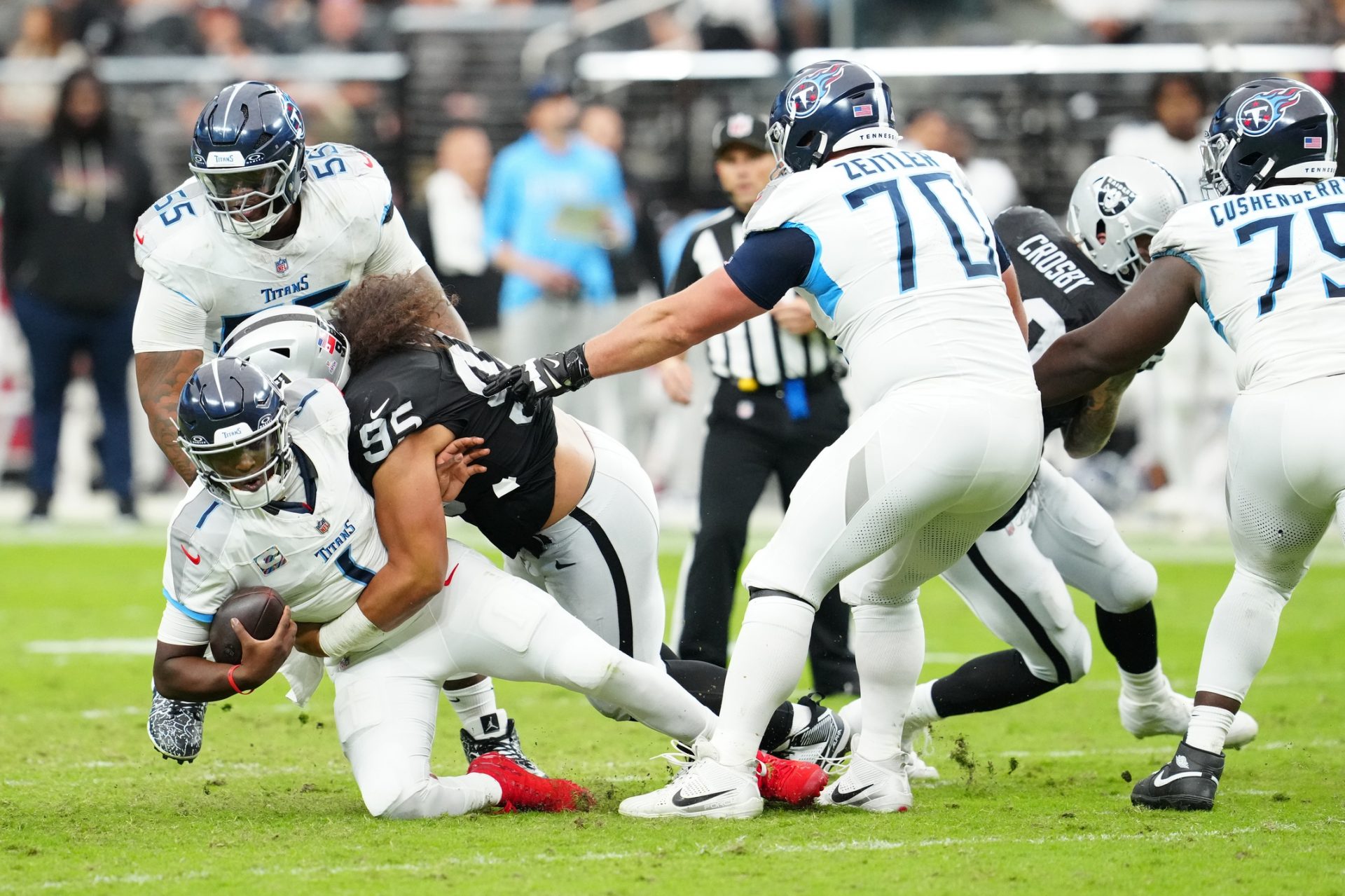 Las Vegas Raiders defensive tackle Leki Fotu (95) sacks Tennessee Titans quarterback Cam Ward (1) during the second half at Allegiant Stadium. Source: Imagn