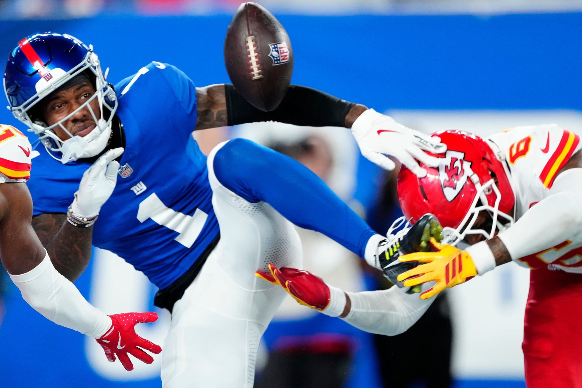 New York Giants wide receiver Malik Nabers (1) looks at a ball that was meant for him as he gets ready to fall in the end zone, in the fourth quarter, Sunday, September 21, 2025. Kansas City Chiefs cornerback Nohl Williams (20) and Kansas City Chiefs safety Bryan Cook (6) is shown on Nabers' sides.